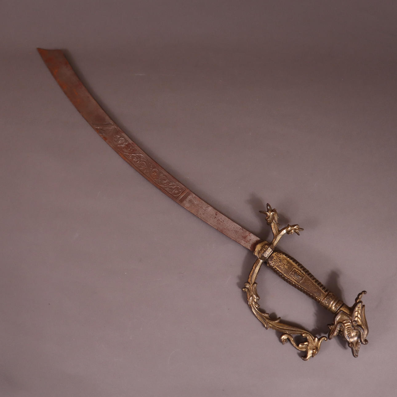 - ORNAMENTAL SWORD in Southeast Asian chestnut style.