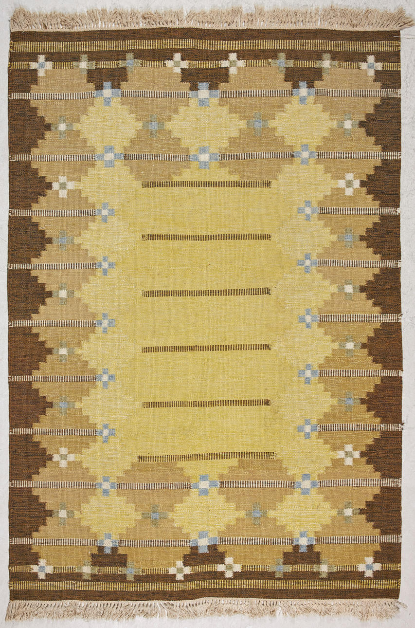 ROLLER SHEET, mat, geometric pattern in brown and yellow, unsigned.