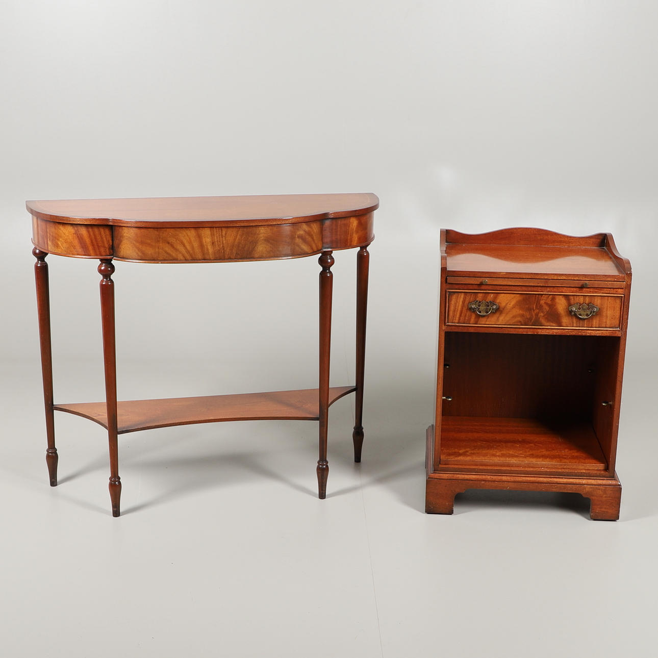 A CHARLES BARR REPRODUCTION SERPENTINE CONSOLE TABLE.