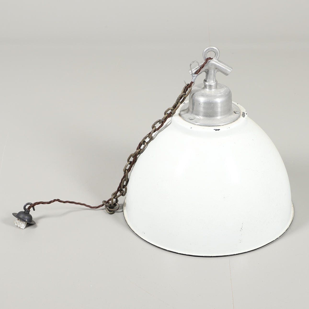 AN INDUSTRIAL STYLE CEILING LIGHT.
