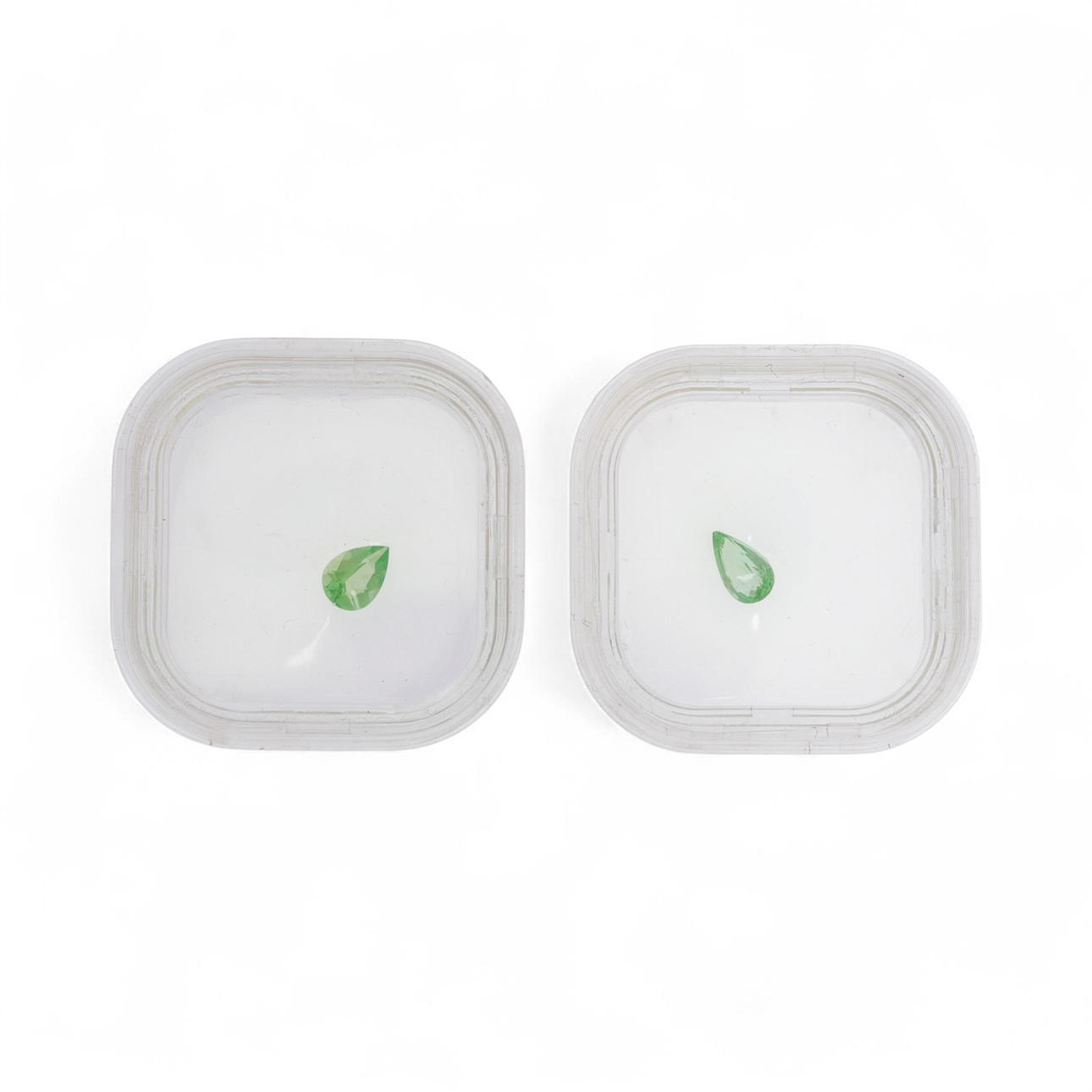 Two unmounted green tourmalines.