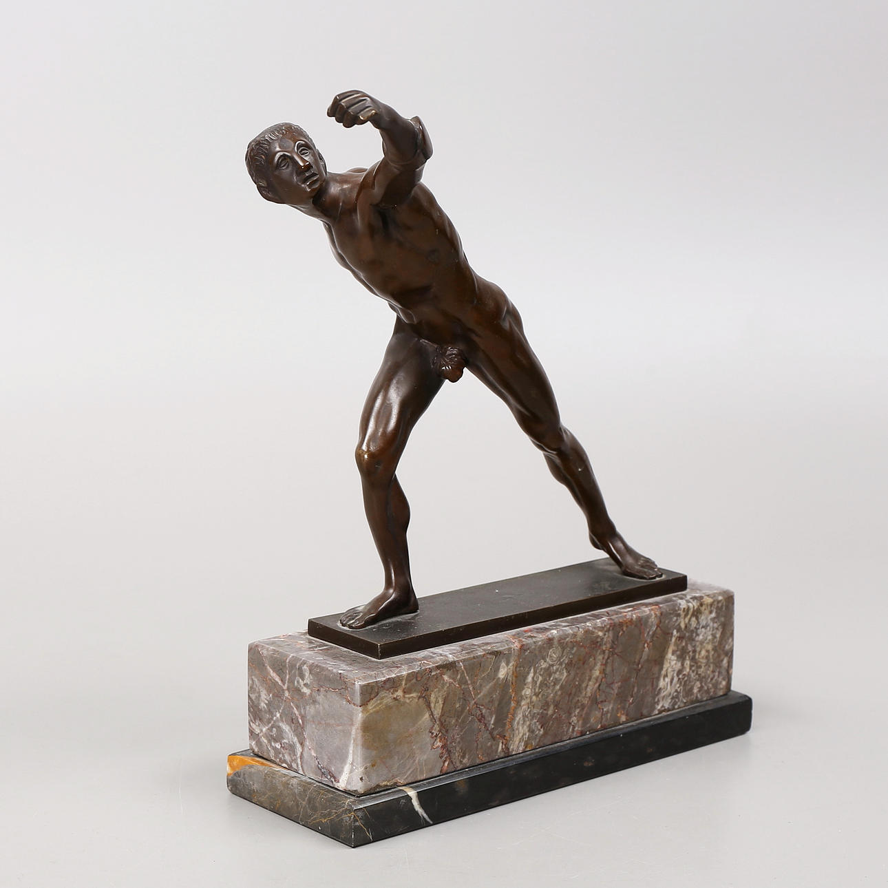 SCULPTURE, athlete, bronze on marble plinth. Germany.