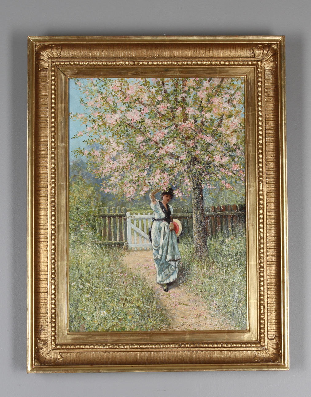 J.E. HOMERVILLE HAGUE. (1885-1903). Kvinna vid blommande fruktträd. Olja på duk, signerad.