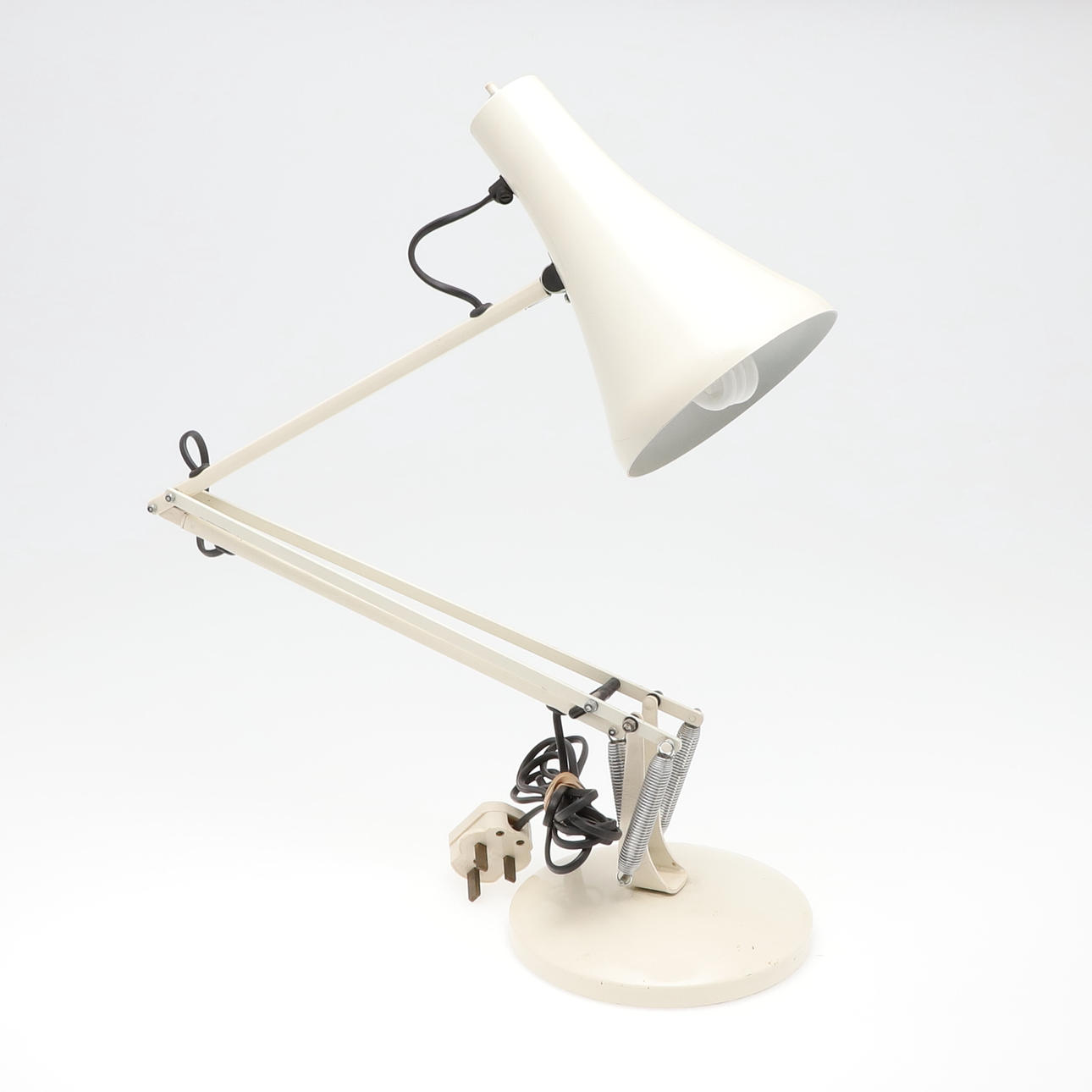 AN ANGLEPOISE LAMP.