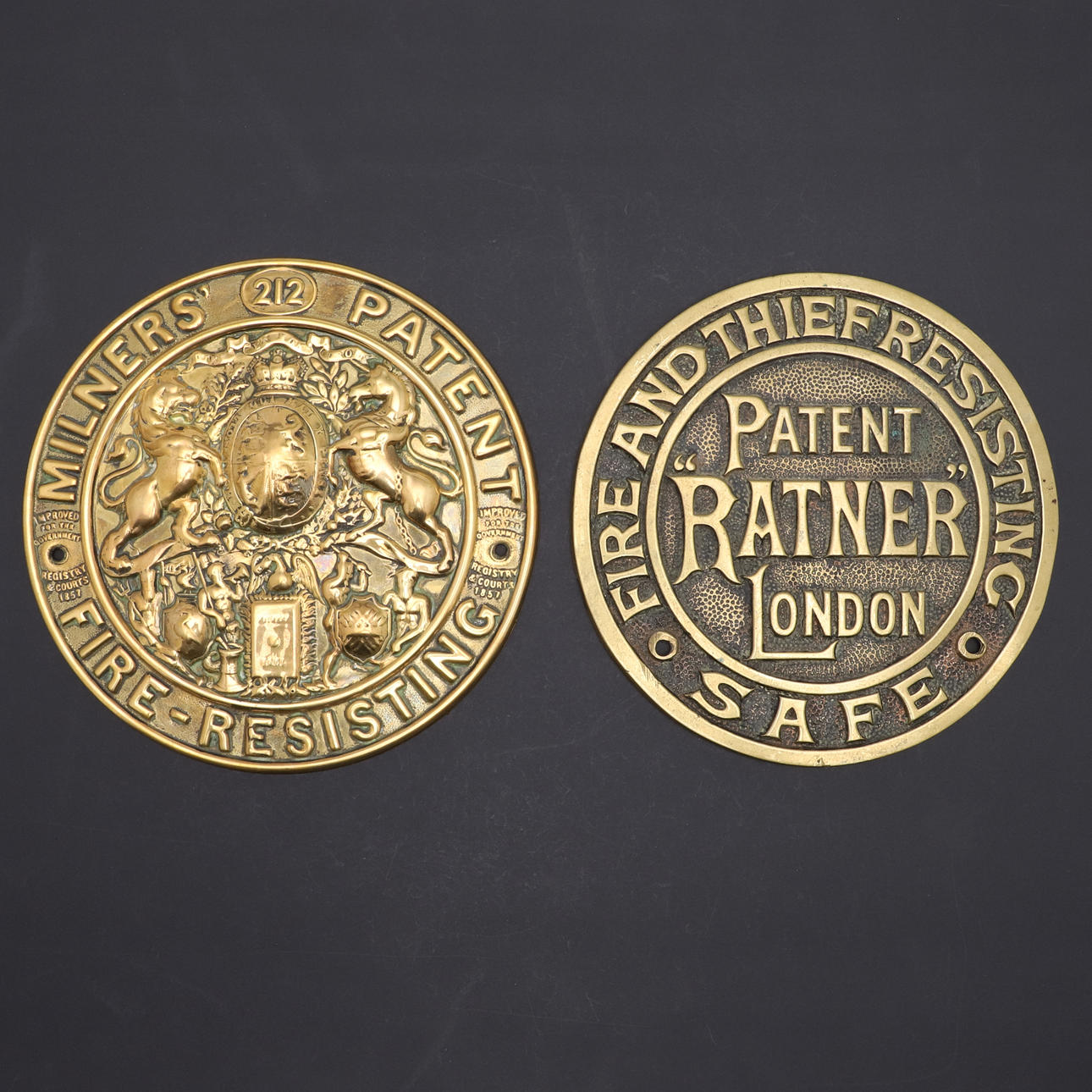 TWO 19TH CENTURY BRASS SAFE PLAQUES.