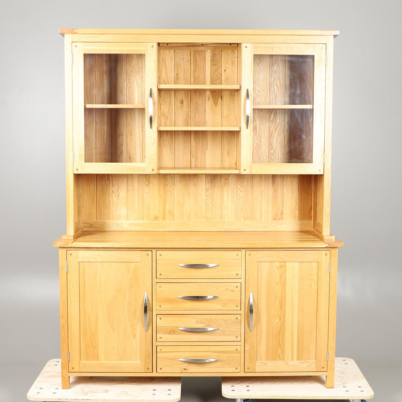 A LIGHT OAK DRESSER.