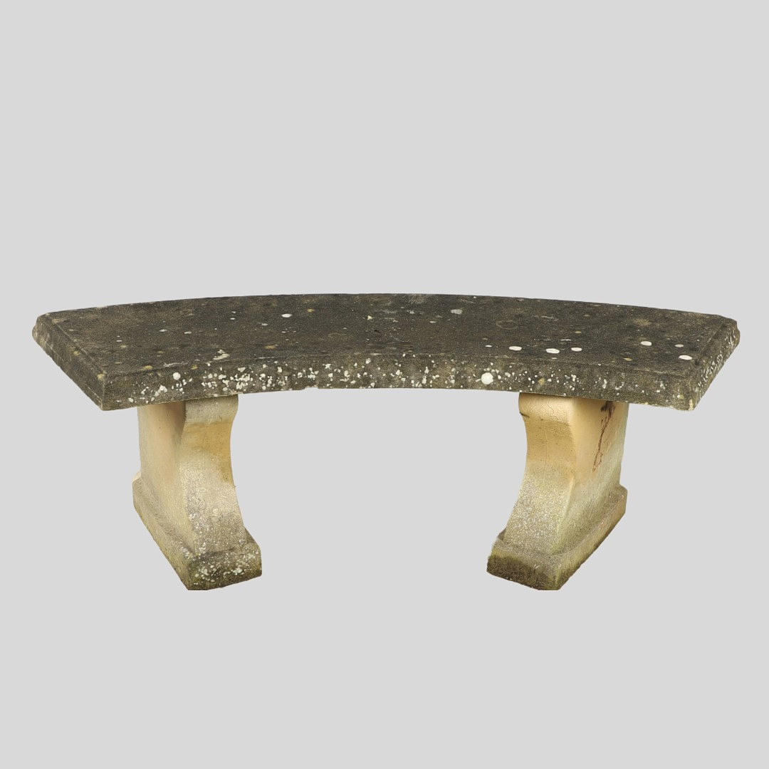 A CURVED RECONSTITUTED STONE GARDEN BENCH.