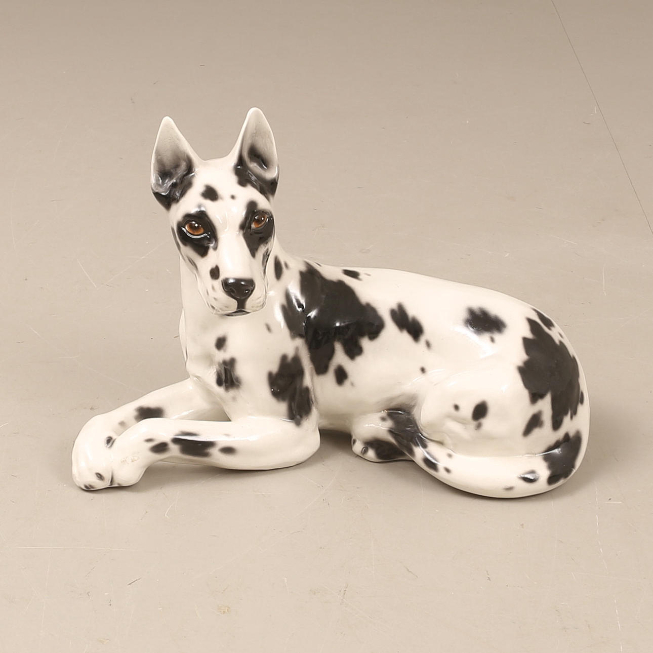 FLOOR FIGURE, reclining dog, porcelain.