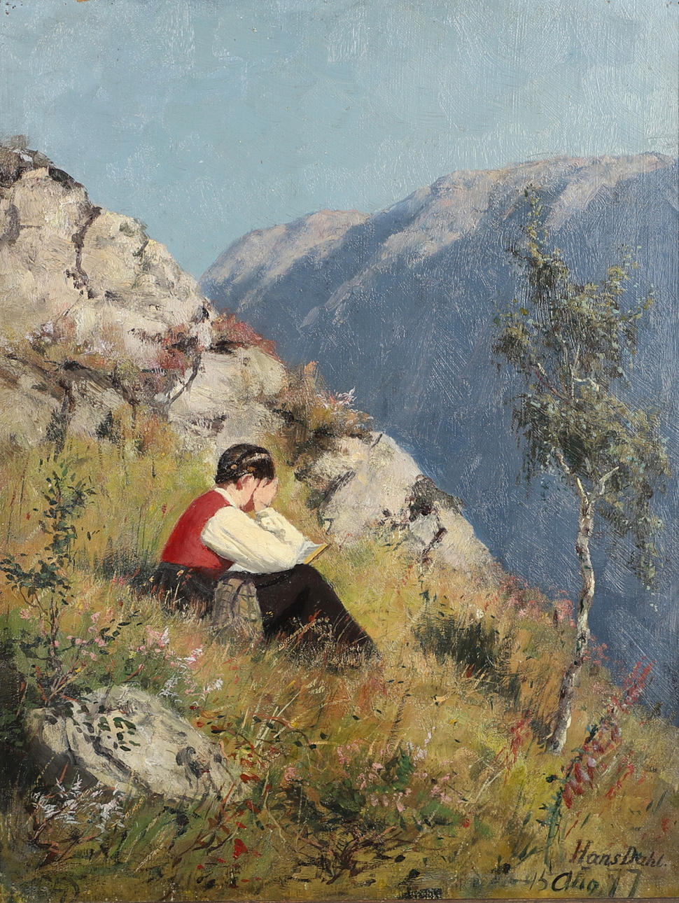 HANS DAHL (1849-1937). A GIRL READING ON A SUNLIT HILLSIDE.