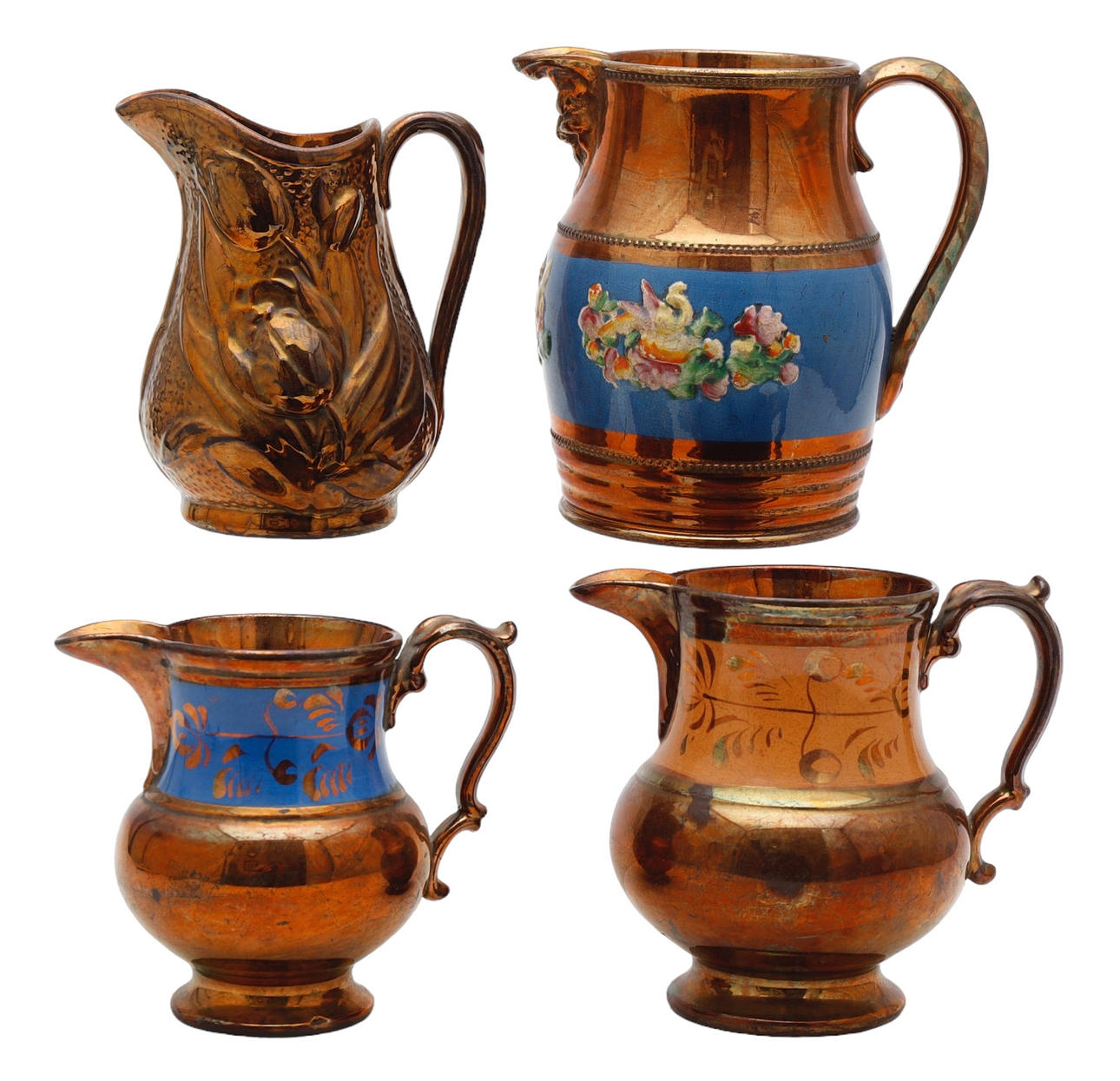 Four Victorian jugs in earthenware with a copper reflection.