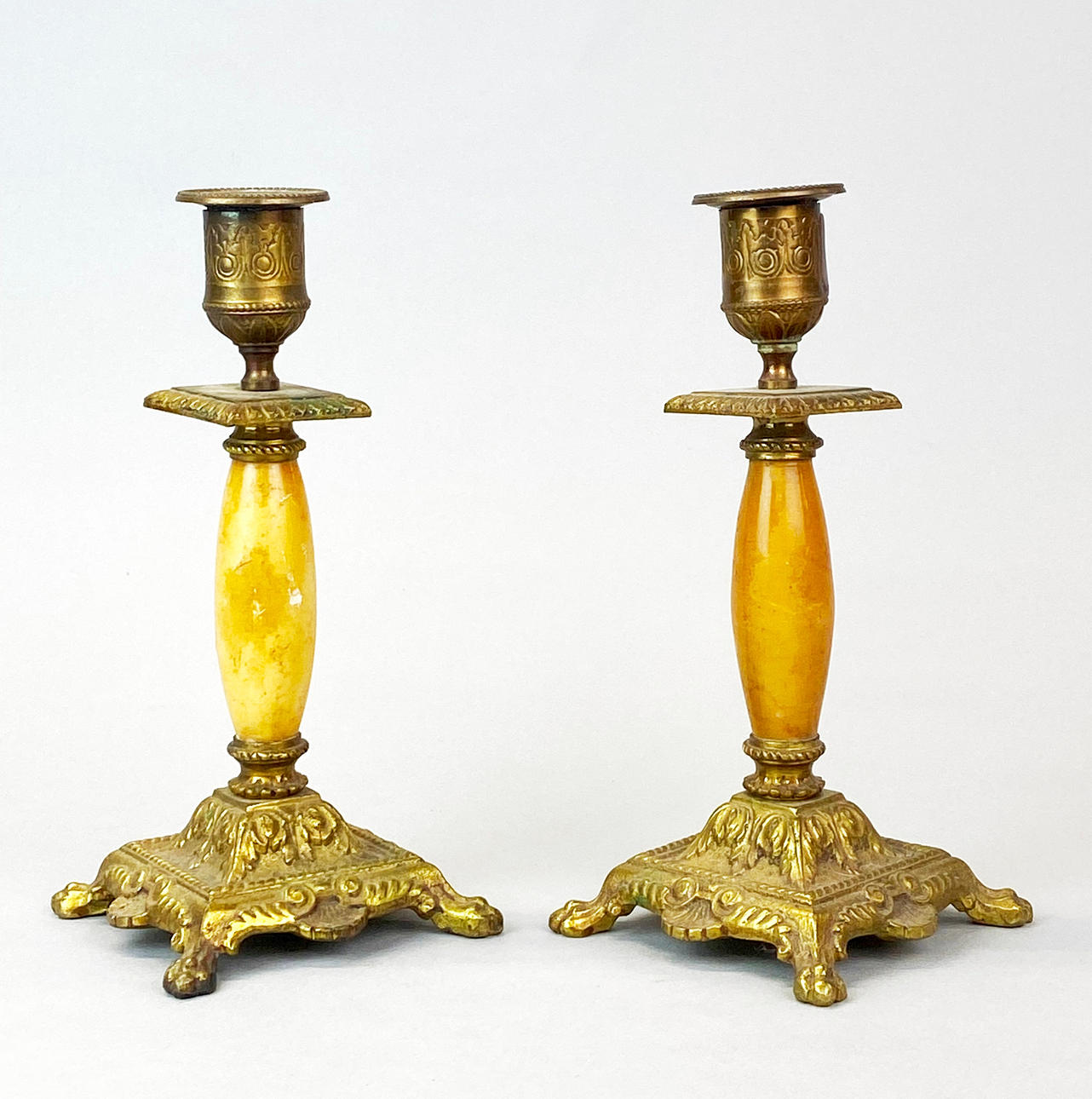 BRASS AND ALABASTER CANDLESTICKS.