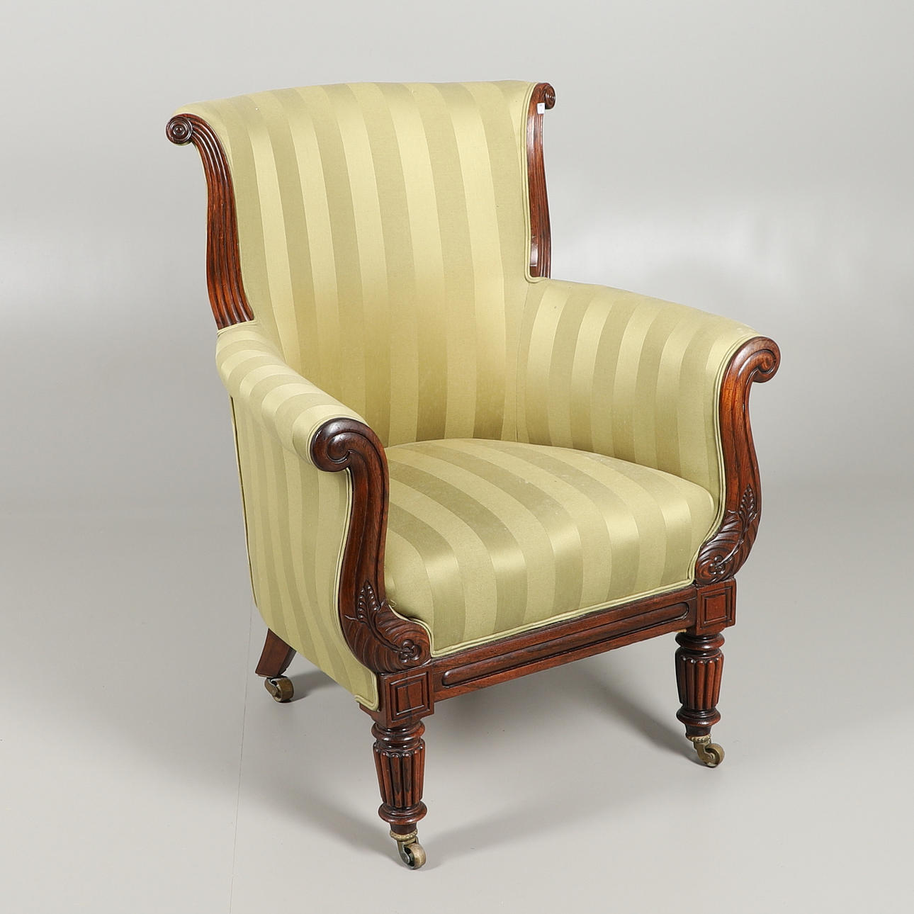 A WILLIAM IV MAHOGANY SCROLL ARMCHAIR.