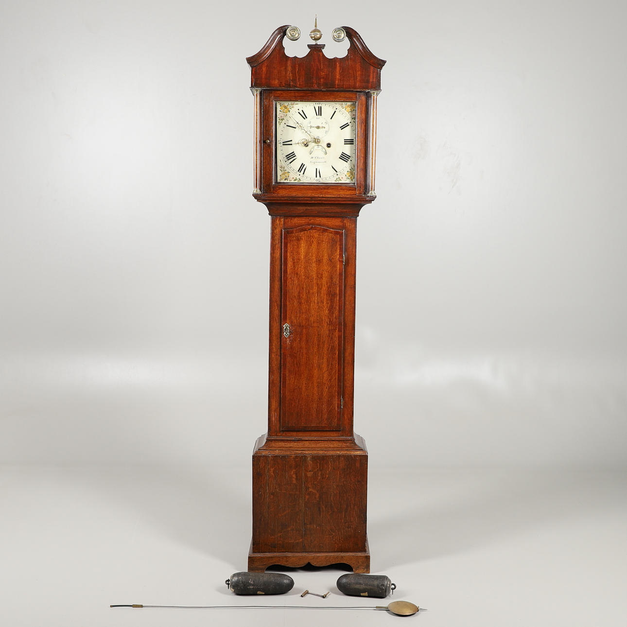 AN OAK 8 DAY LONGCASE CLOCK.