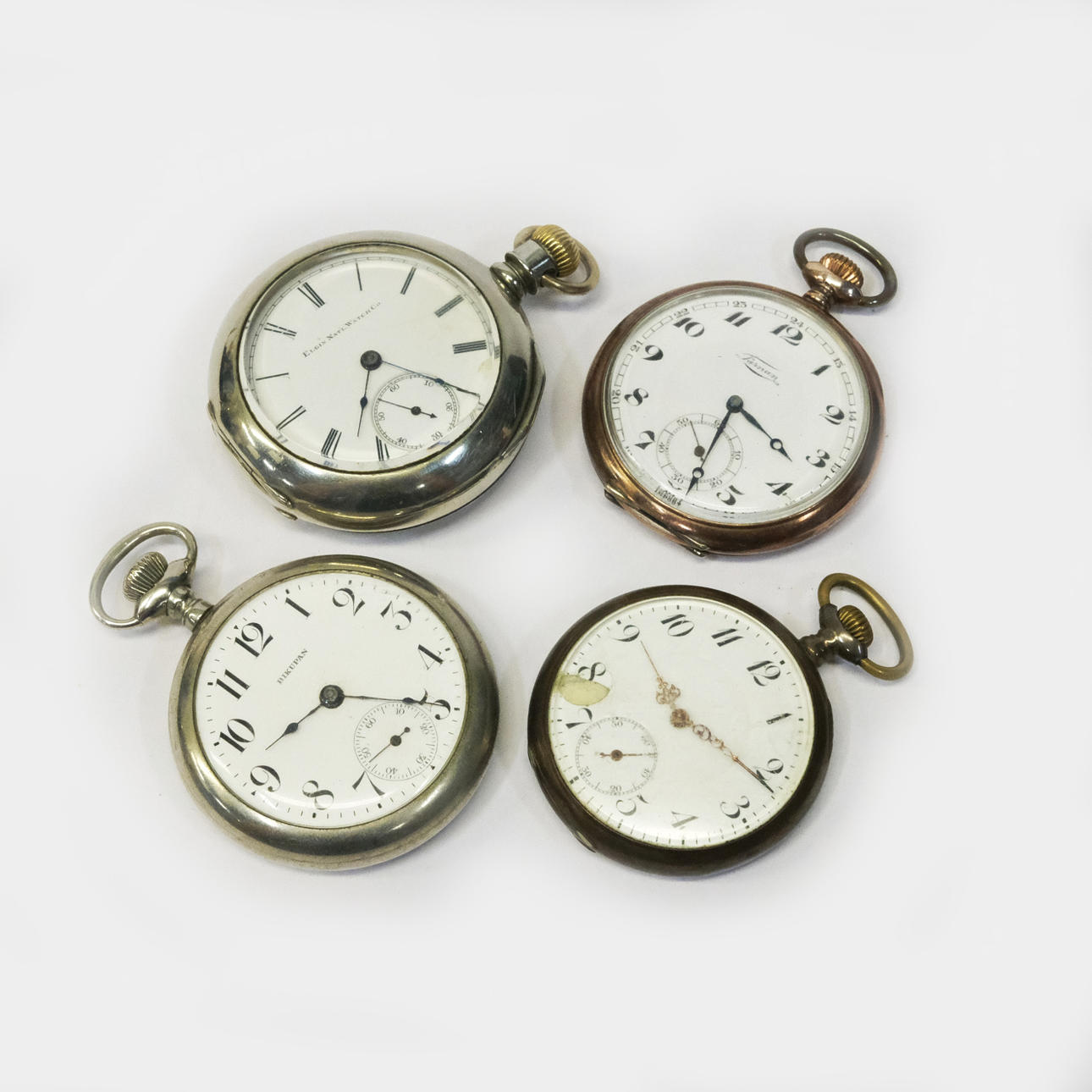 FOUR POCKET WATCHES. PARTIAL SILVER CASES. BL.A. ELGIN.