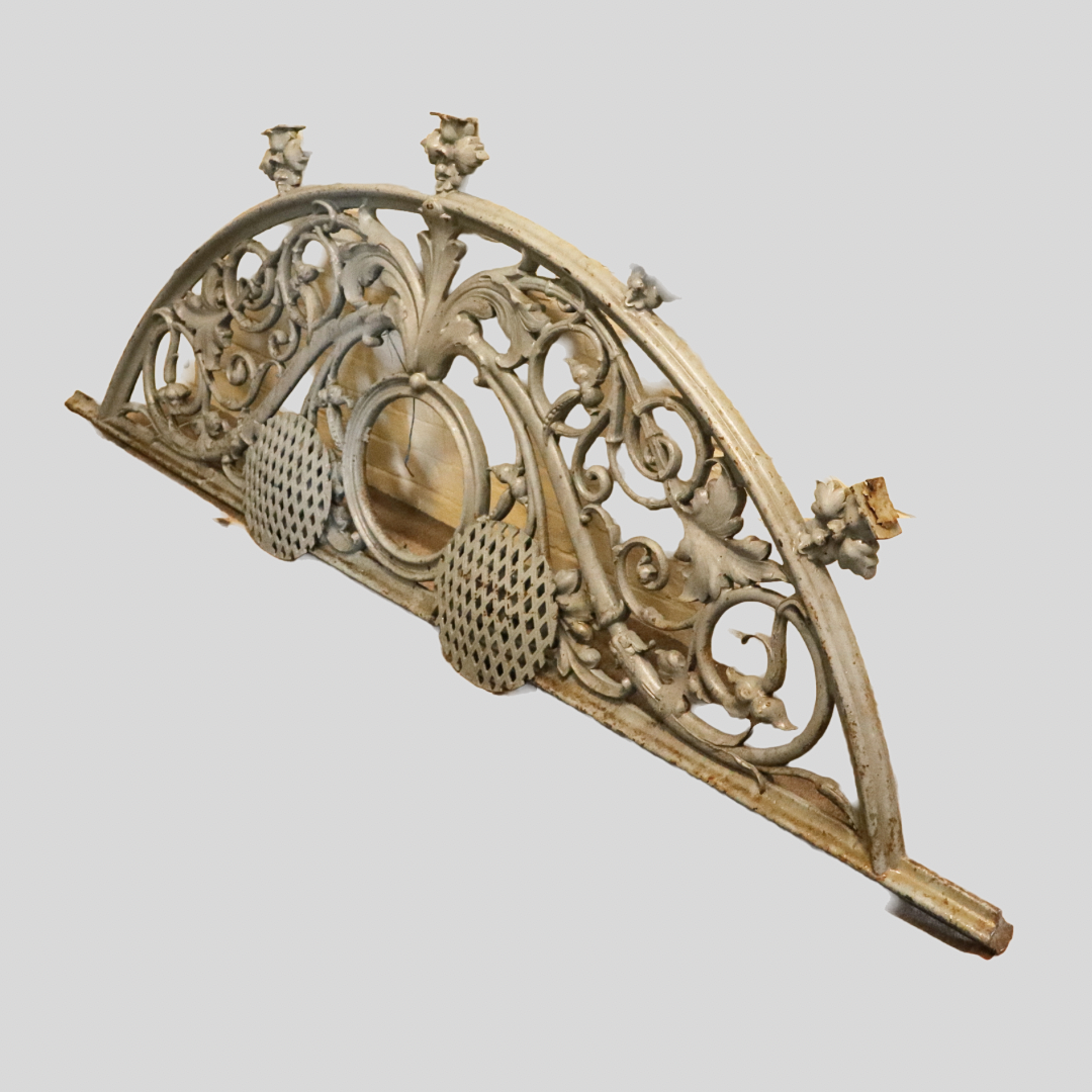 A VICTORIAN GREY PAINTED CAST IRON ARCH FEATURE.