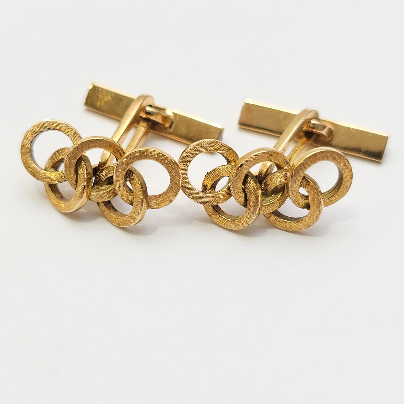 GEMELOS "AROS OLÍMPICOS" EN ORO AMARILLO DE 18 K.