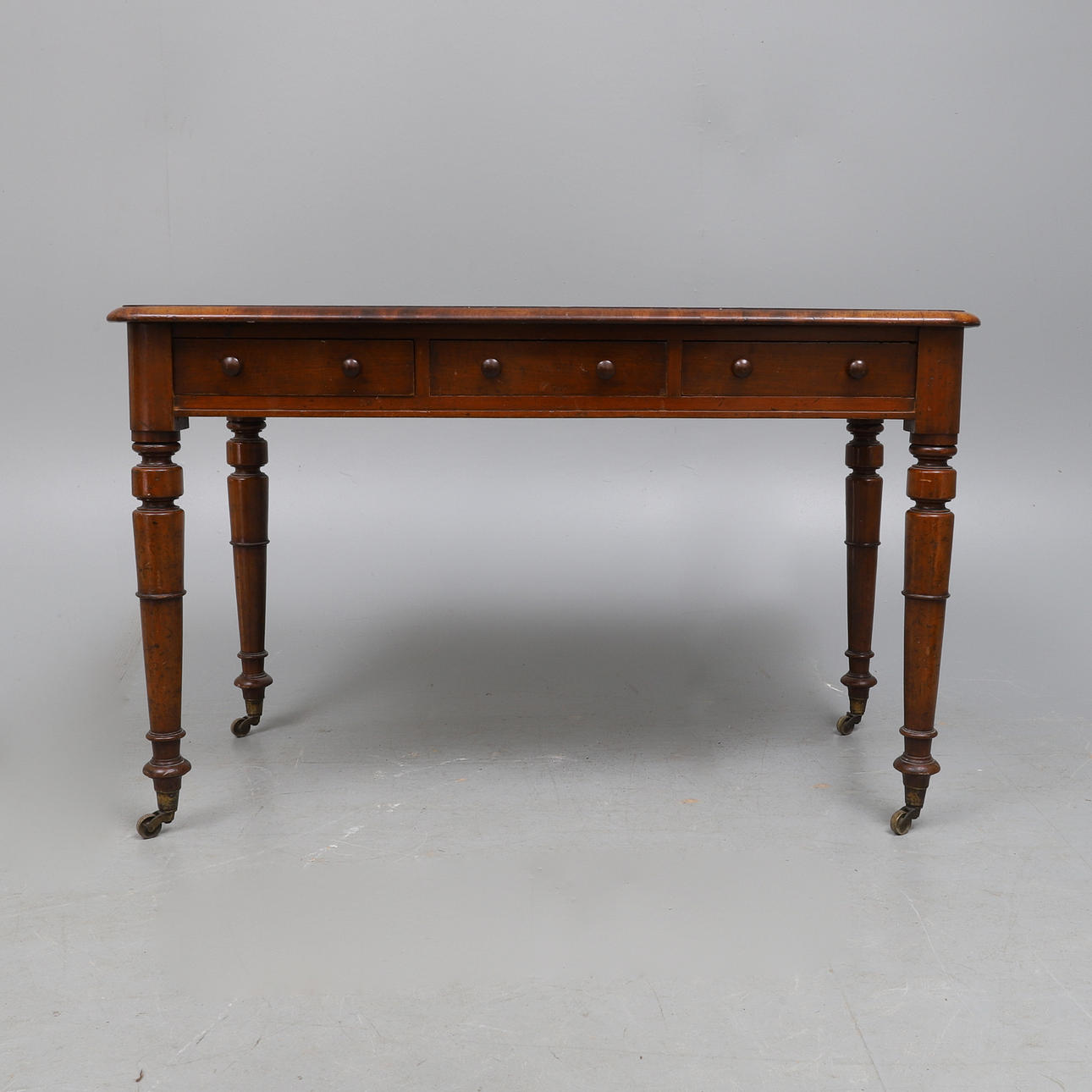 A VICTORIAN MAHOGANY WRITING TABLE, CIRCA 1860.