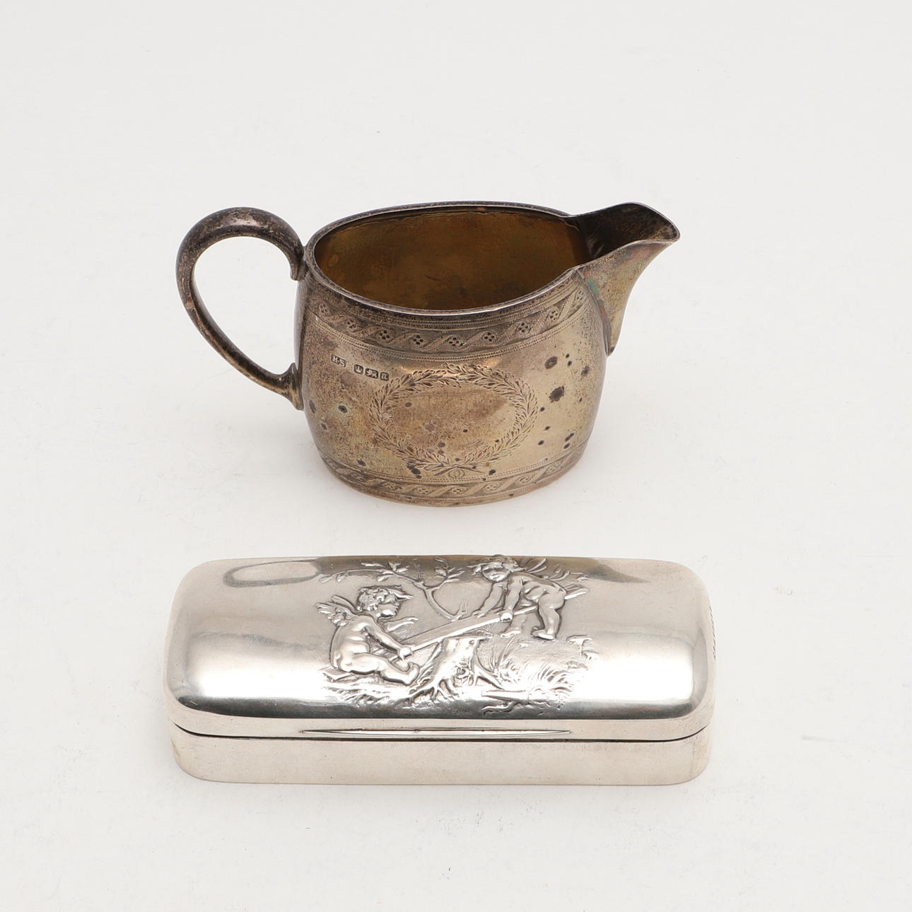 A VICTORIAN ENGRAVED MILK JUG.