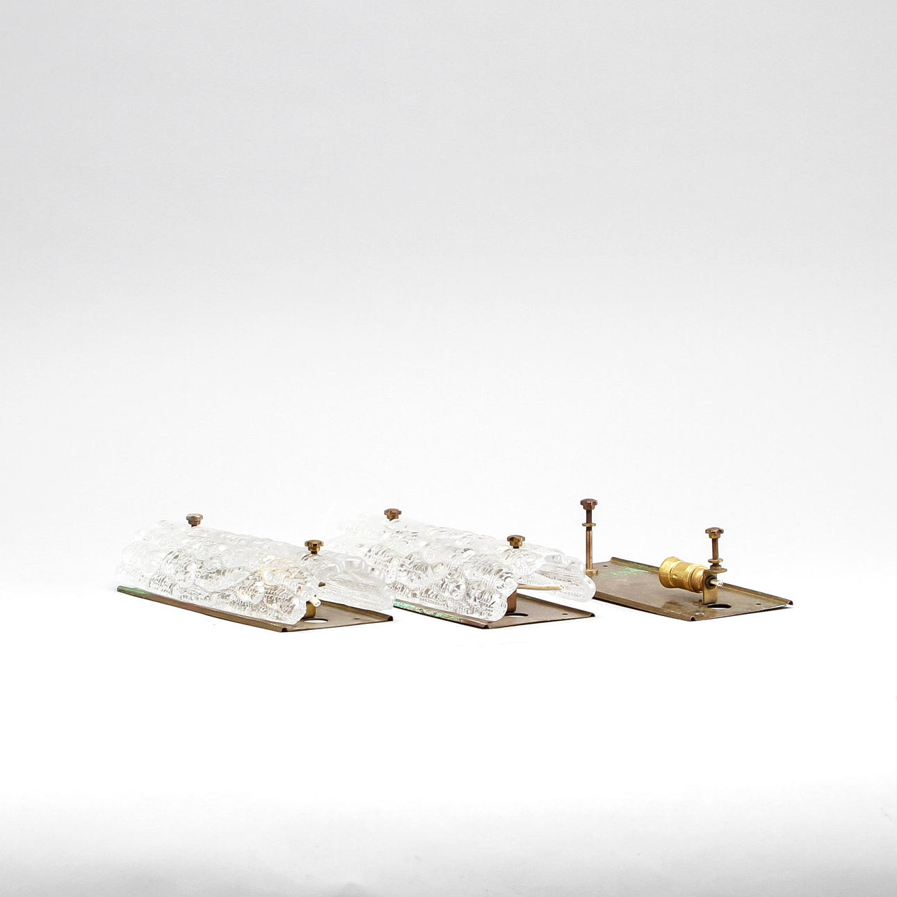 VÄGGLAMPETTER, ett par, glas, Orrefors.