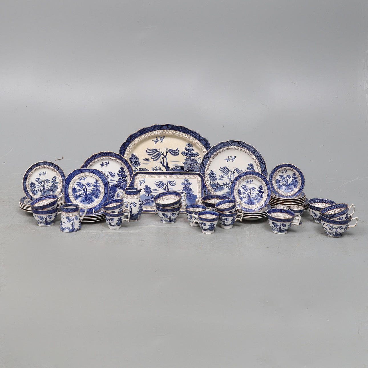 A BOOTHS 'REAL OLD WILLOW' PATTERN FORTY-NINE PART TEA SERVICE.