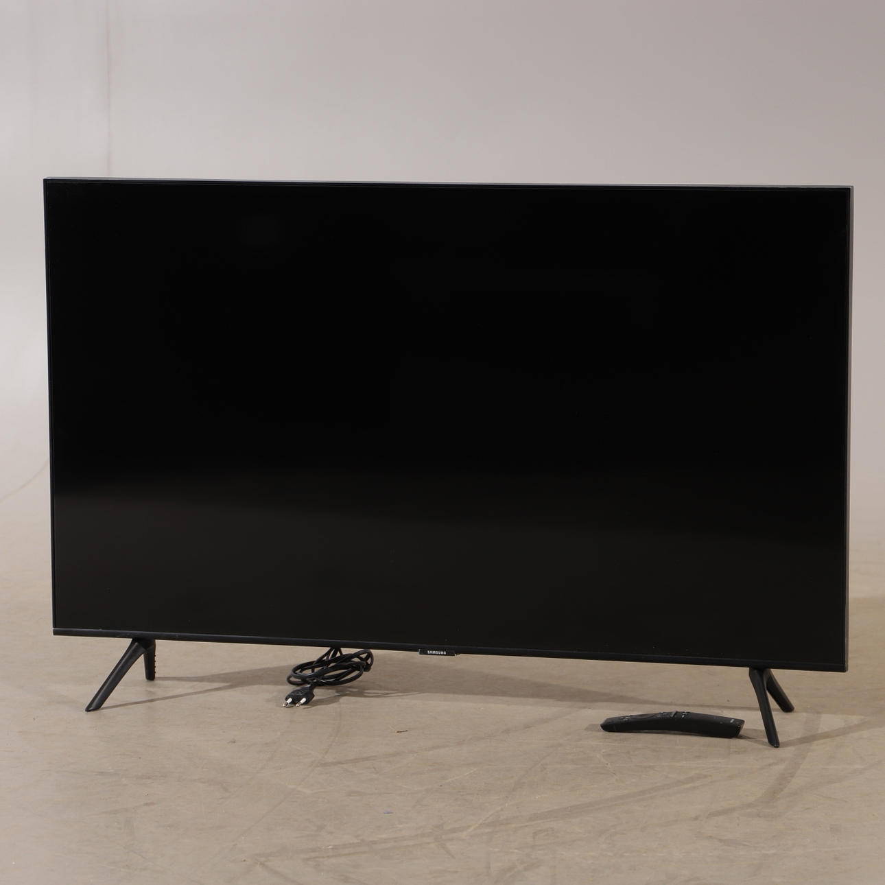 Fernseher mit Fernbedienung, Samsung.