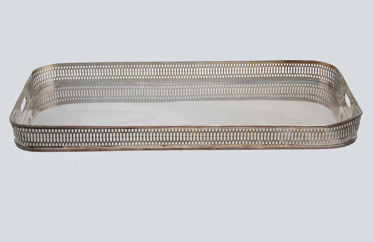 Tray with openwork gallery in silvery metal.