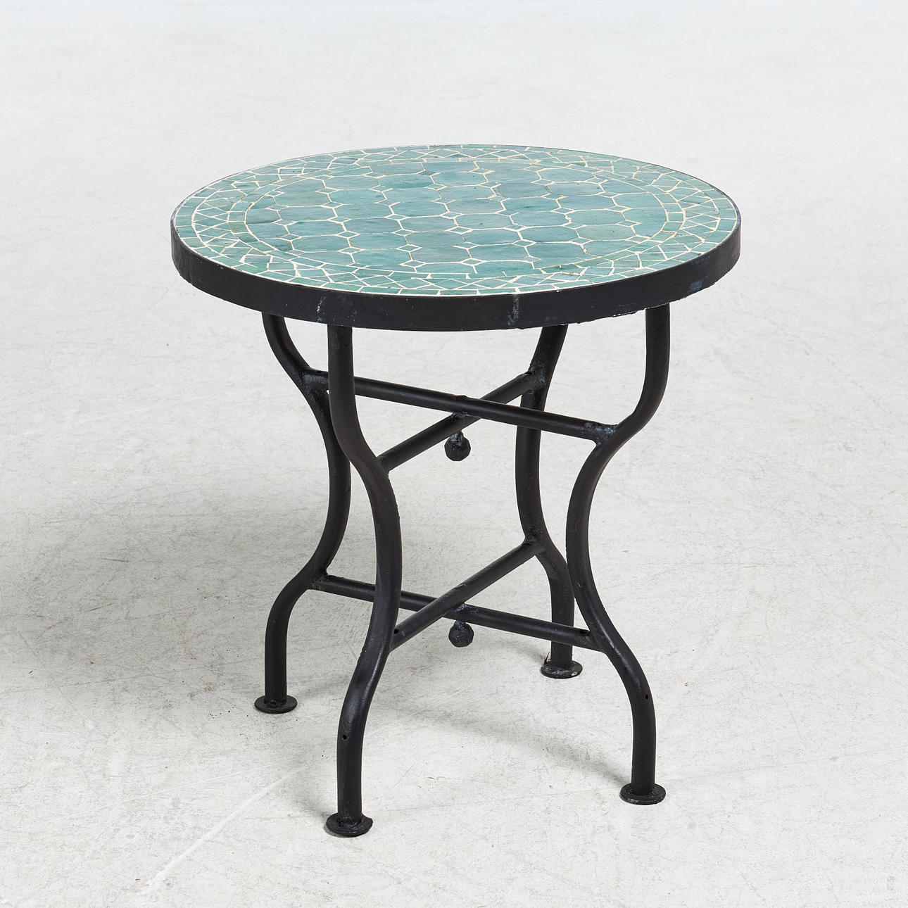 TABLE, mosaic top on cement, forged legs.