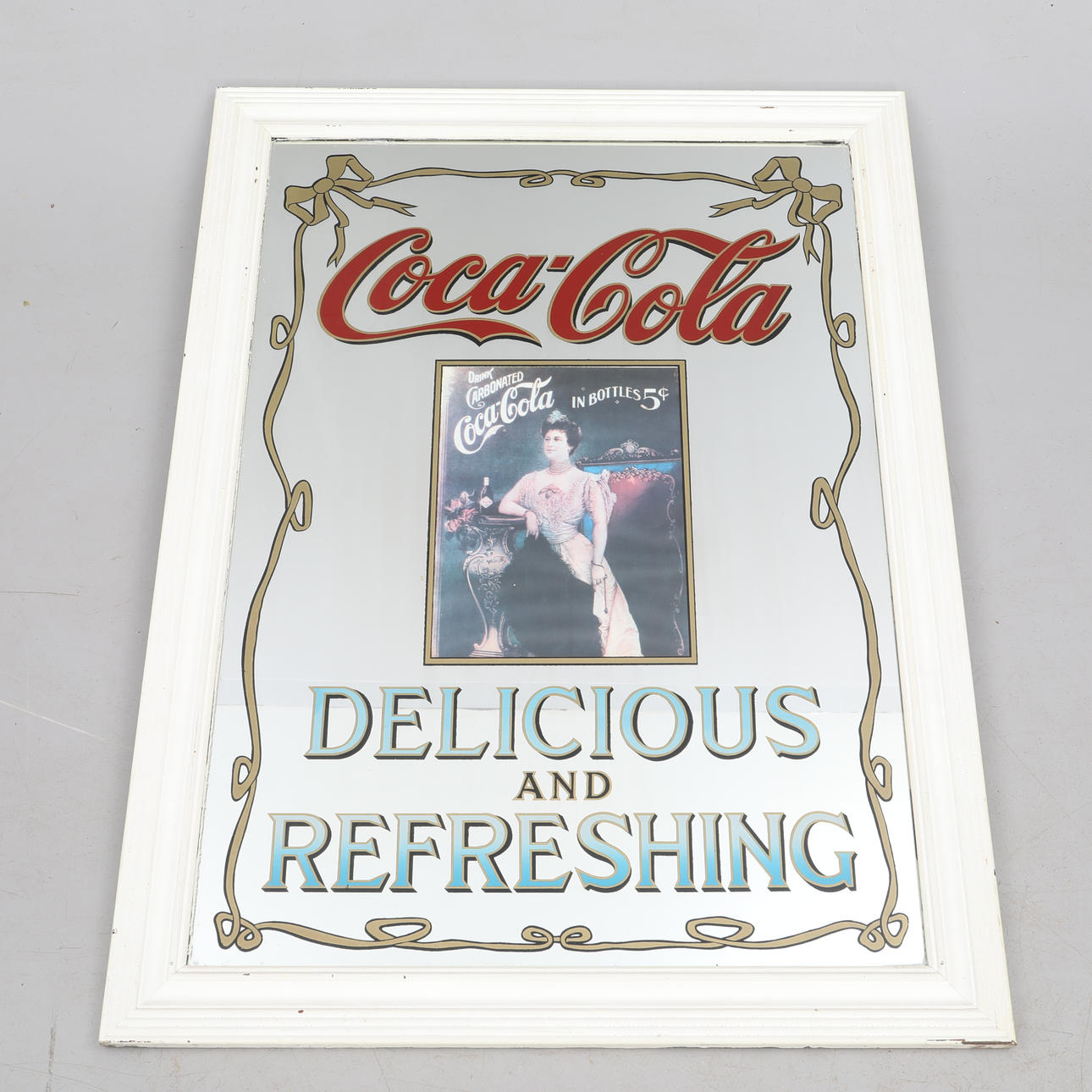 SPEGEL, med reklamtryck Coca cola.