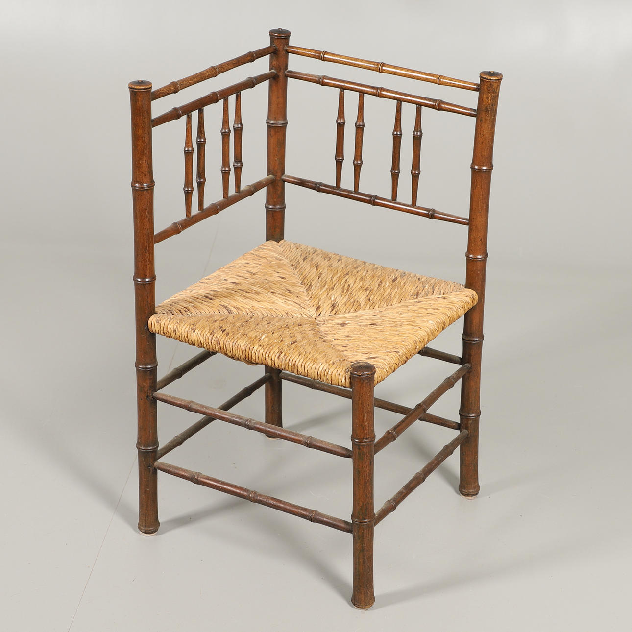 A 19 TH CENTURY BAMBOO CORNER CHAIR.