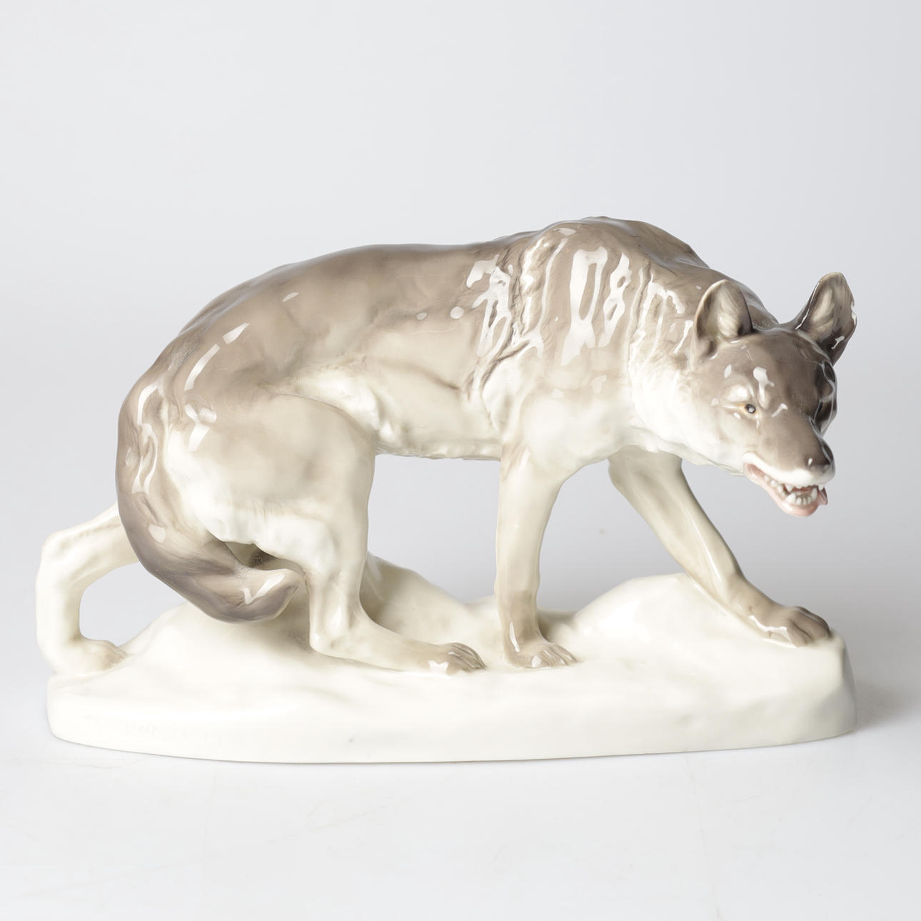 WALDEMAR LINDSTRÖM. Figurine, wolf, porcelain, Rörstrand.