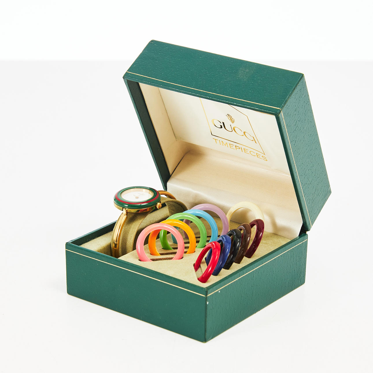 GUCCI, wristwatch. Gold-plated, quartz, plexiglass, replaceable rings in different colors, original box.