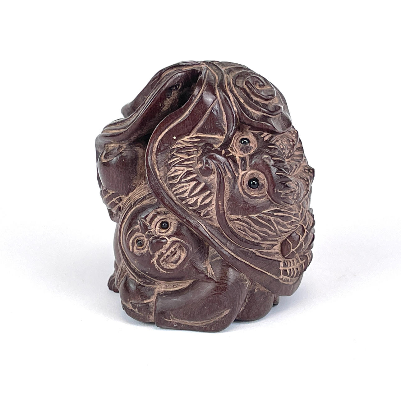 NETSUKE OF A MAN & DRAGON.