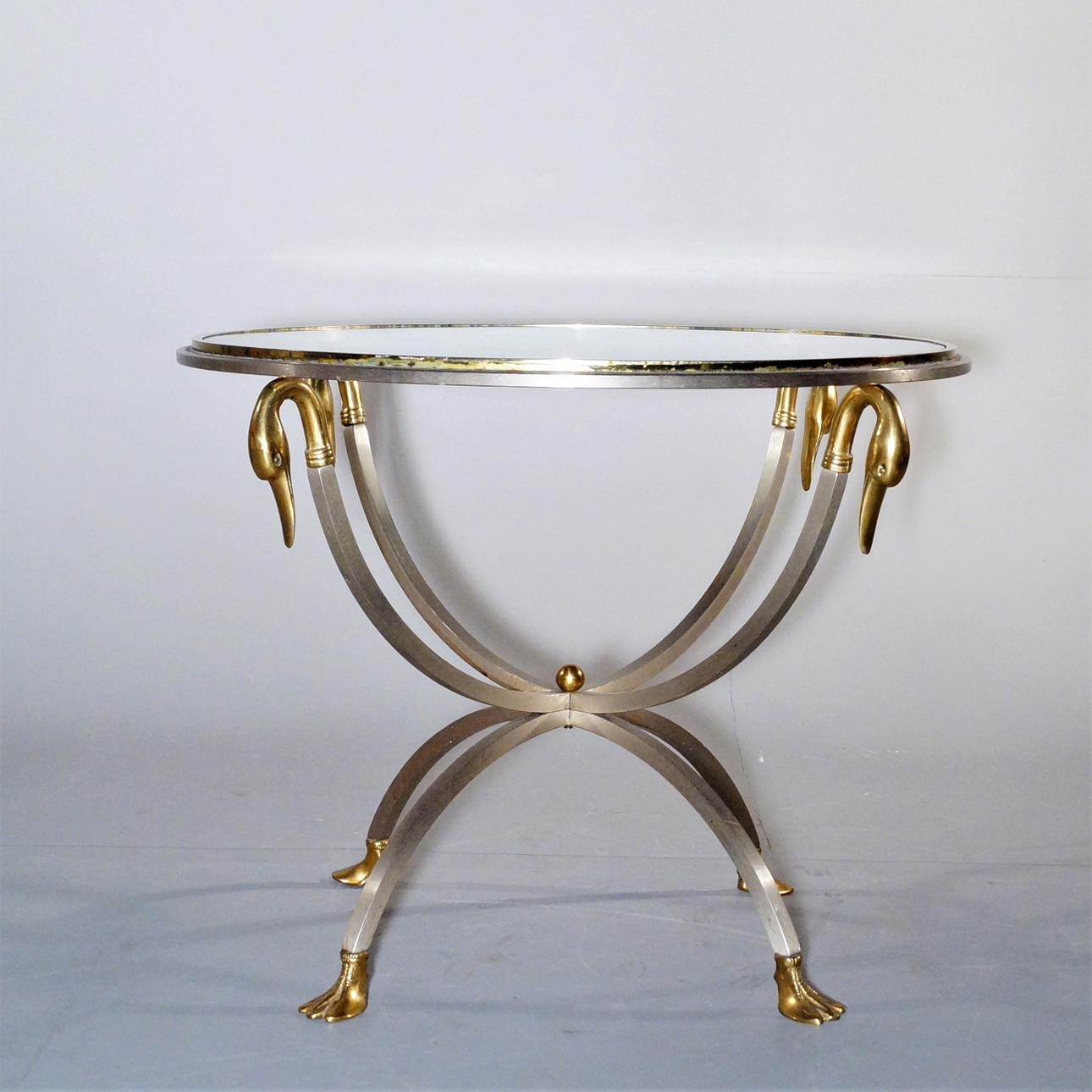 GLASS TABLE, metal base with swans.