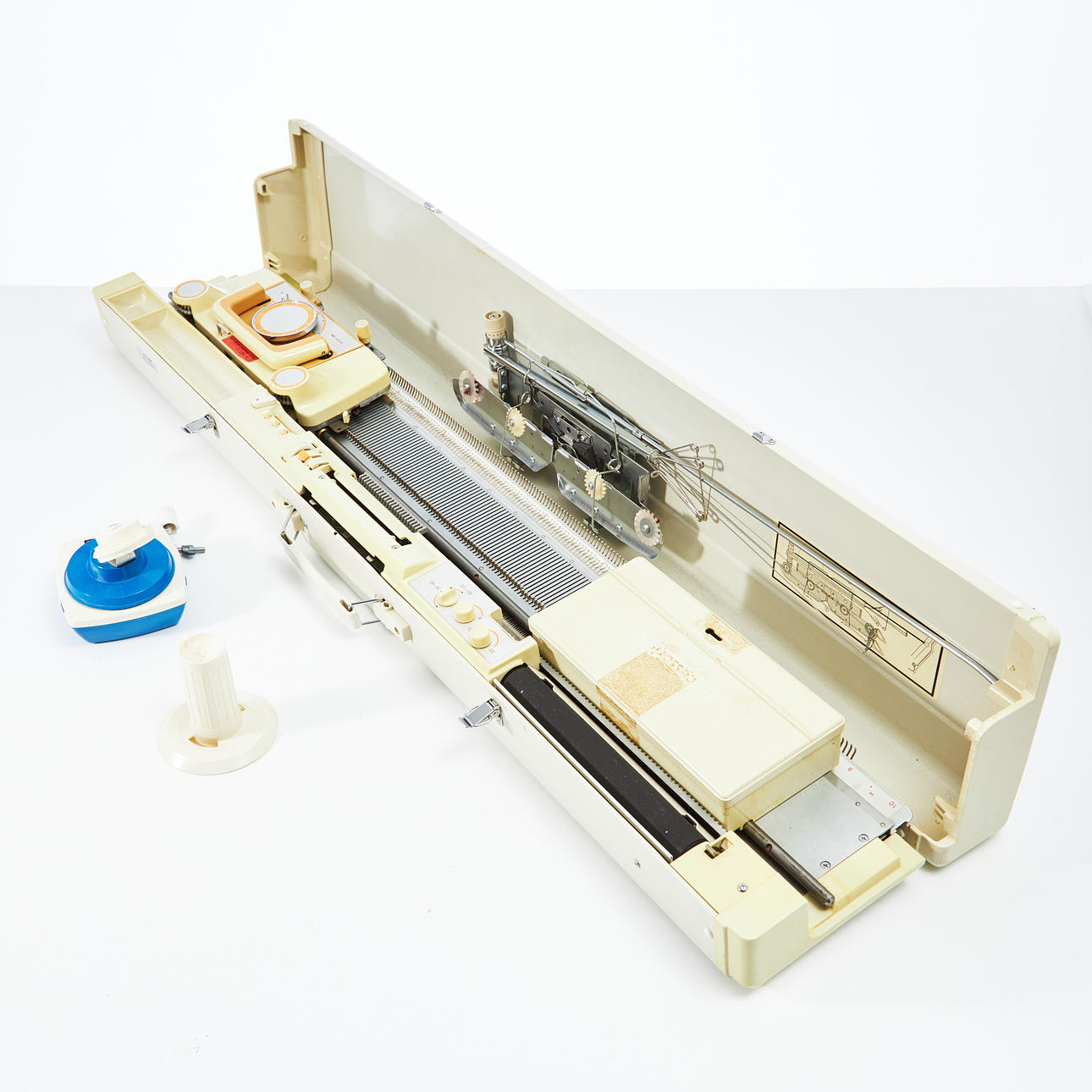 KNITTING MACHINE, "Empisal Knitmaster", model 326, circa 1970s, with separate yarn holder.