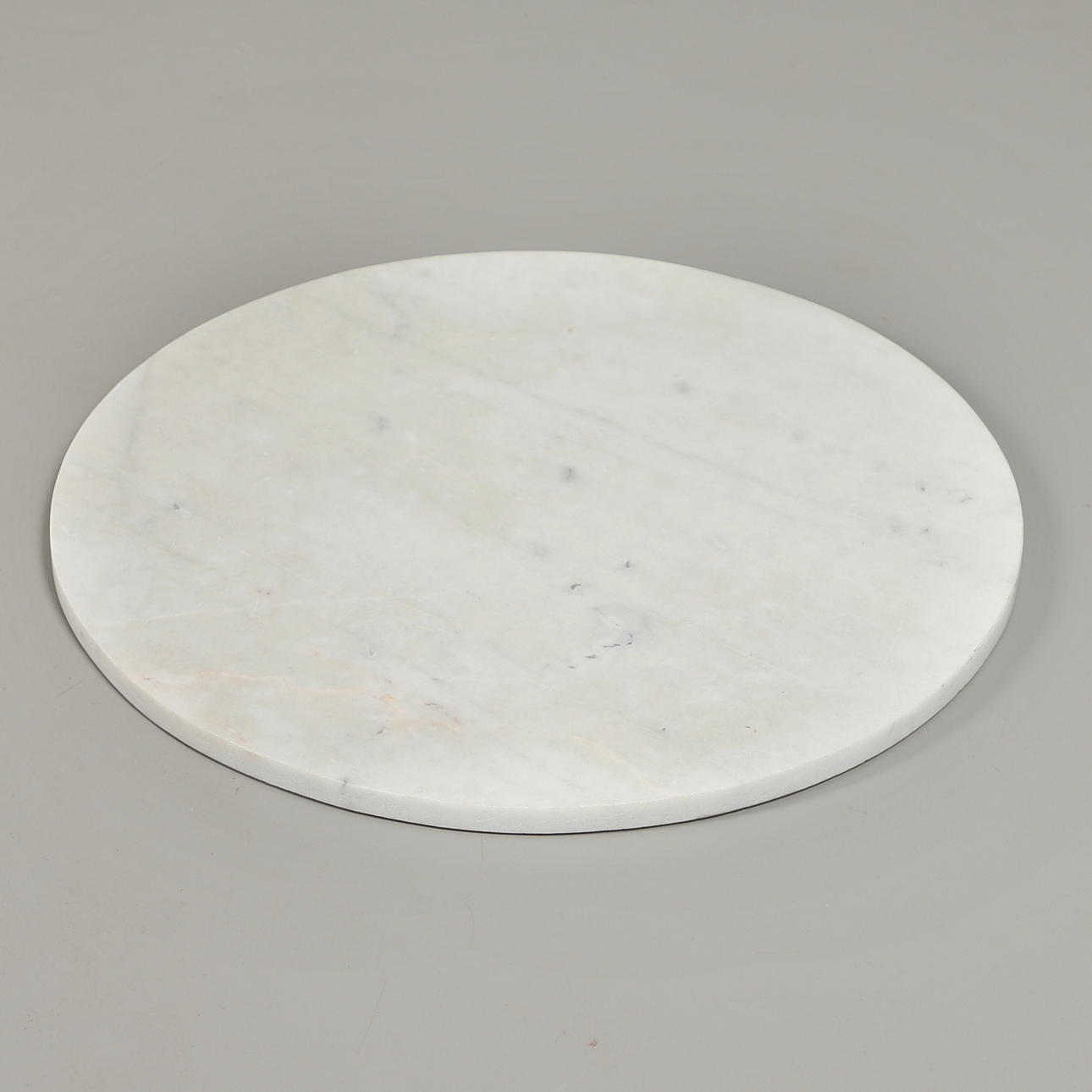 A CIRCULAR MARBLE TABLE TOP.