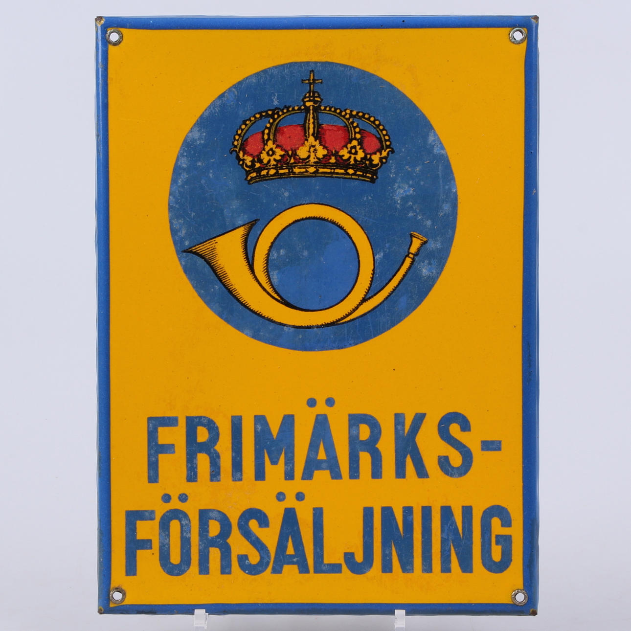 SKYLT, emalj "Frimärksförsäljning", 1900-talets andra hälft.