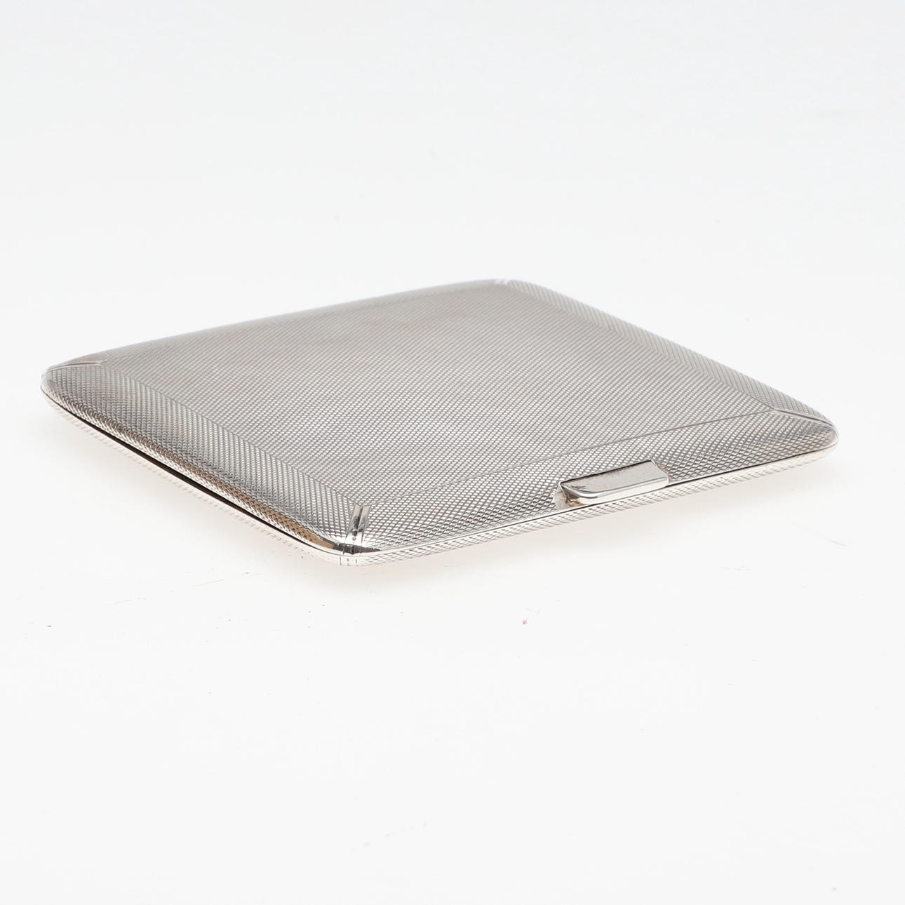 A SILVER CIGARETTE CASE.