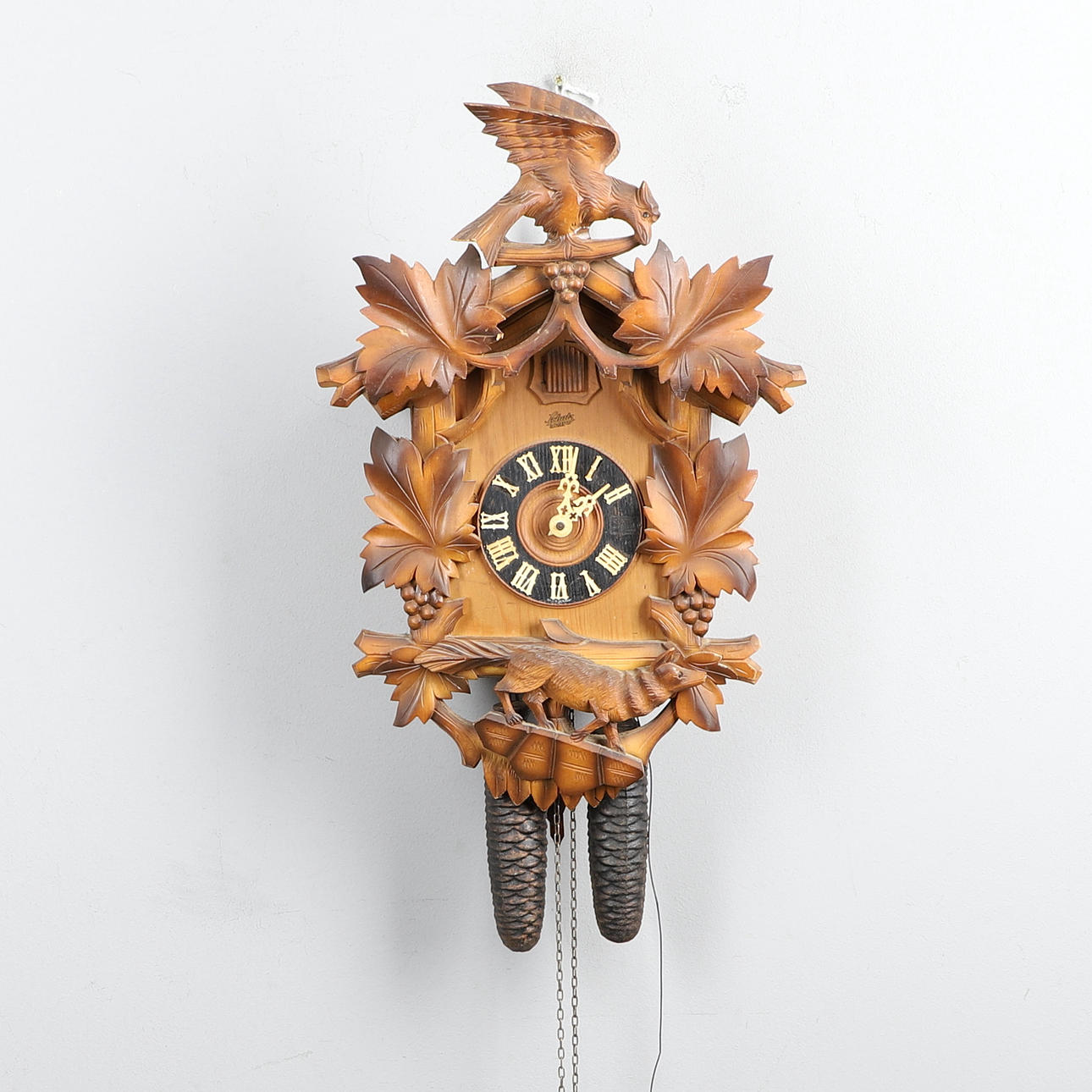 A PINE CUCKOO CLOCK.