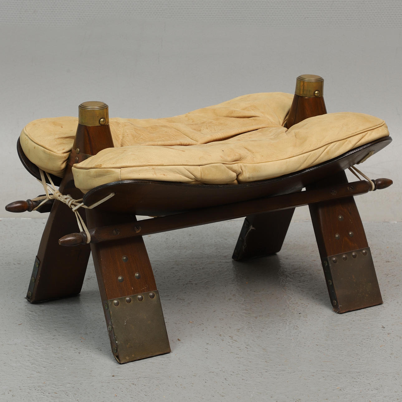 CAMEL PALL, embossed leather & wood, 1900s.