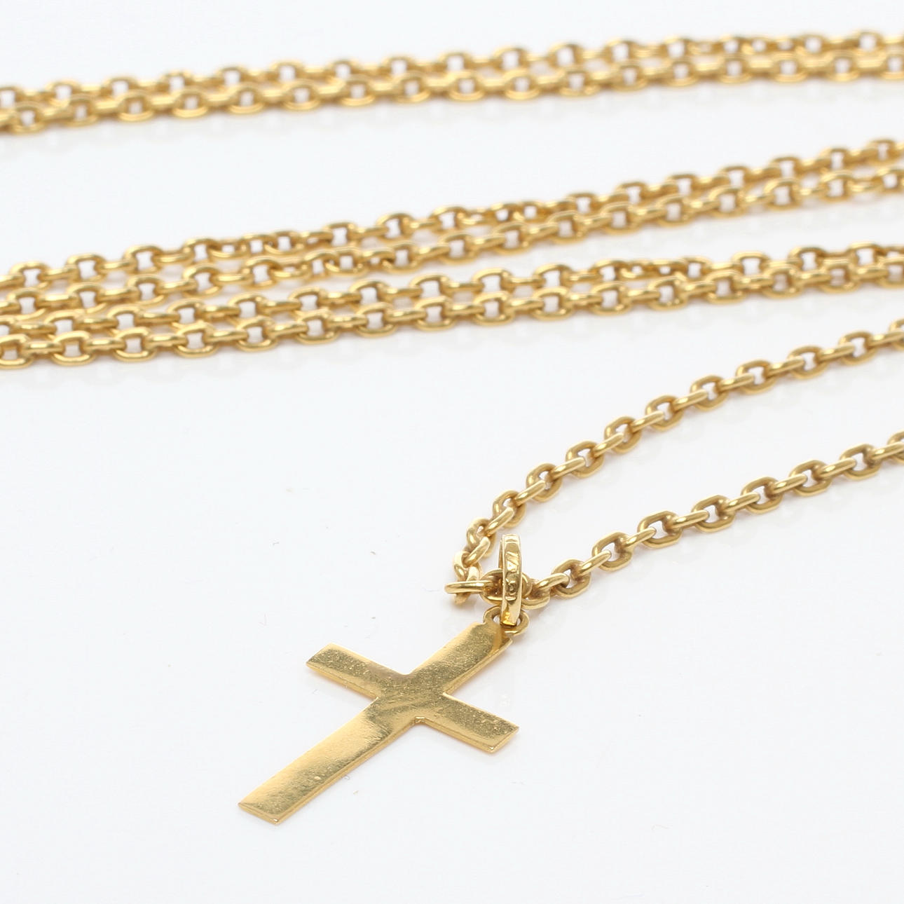 KEDJA samt HÄNGE i form av kors, 18k guld, 1900-tal.