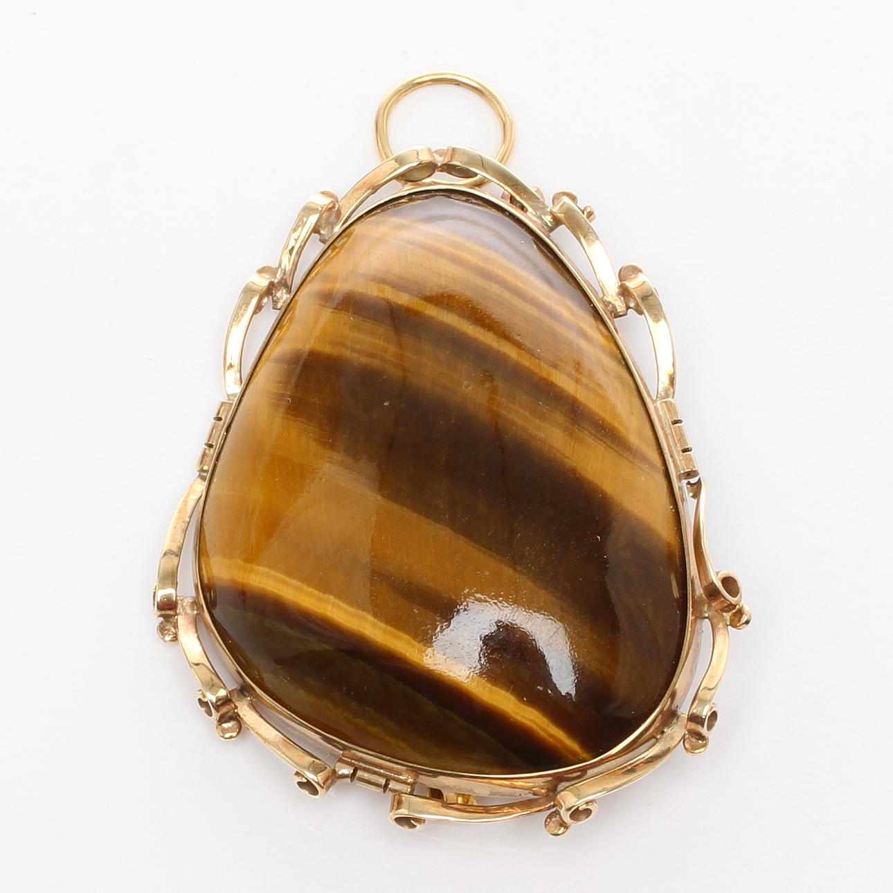 BROSCH/HÄNGE, lågkaratigt guld med slipad sten, 1900-tal.