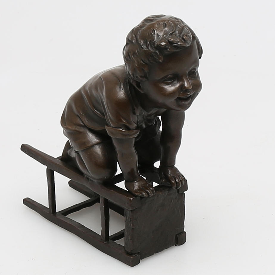 BRONSFIGUR "pojke på taburett", senare avgjutning, märkt Juan Clara.