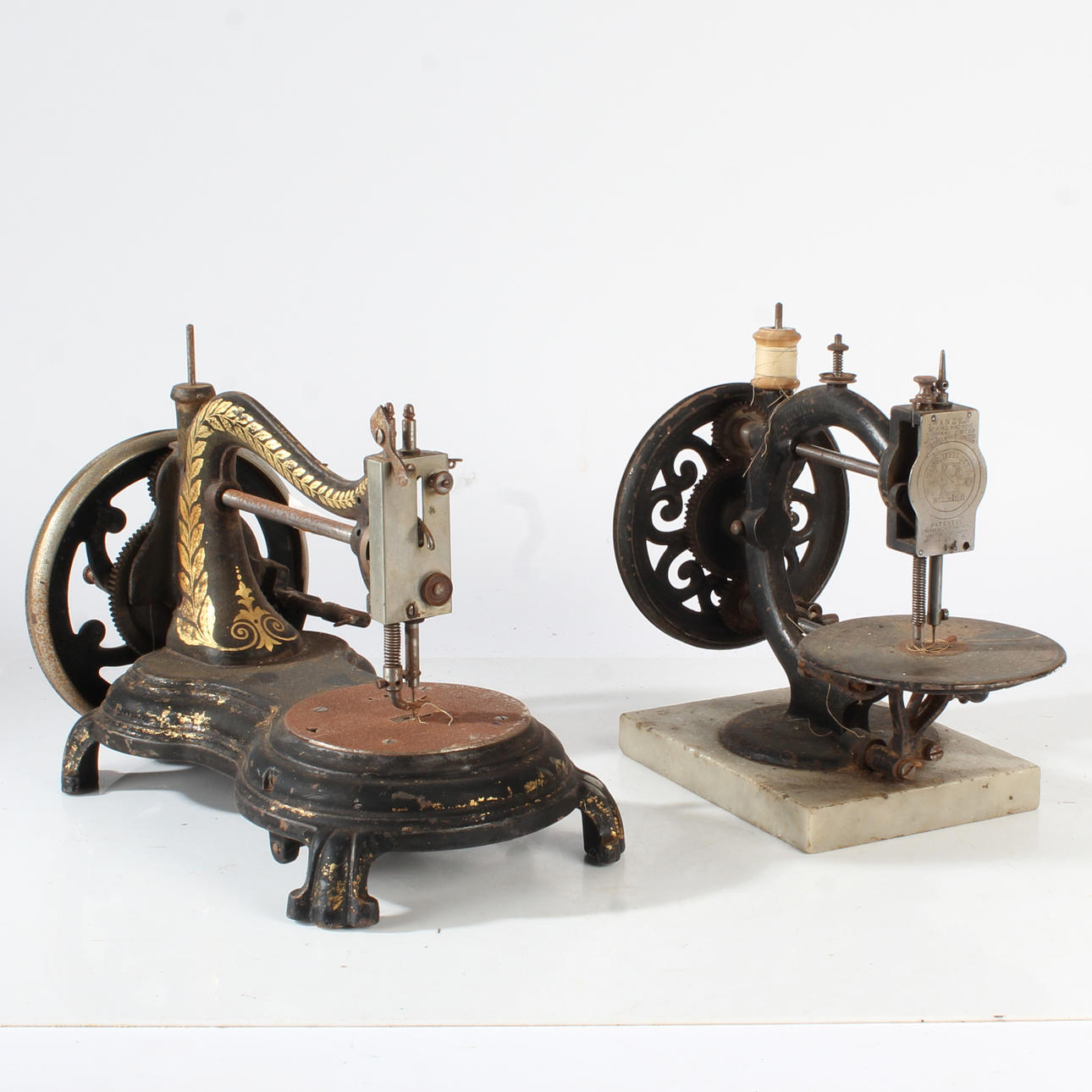 TWO UNNAMED 20TH CENTURY SEWING MACHINES.