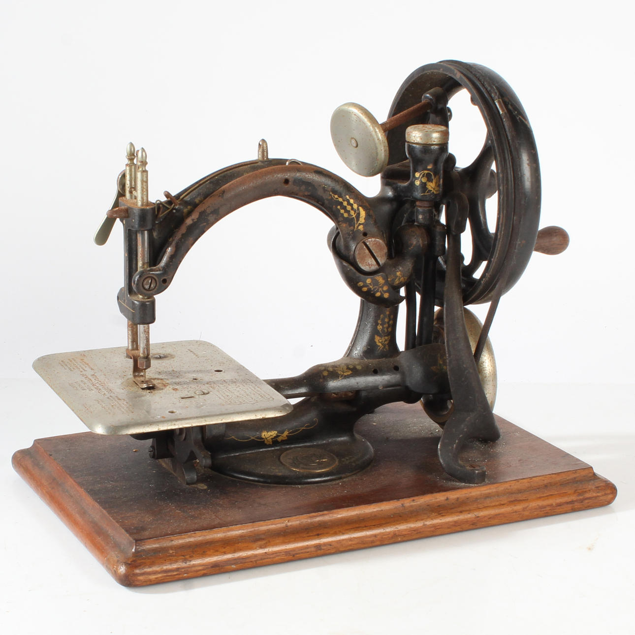 A 19TH CENTURY WILLCOX & GIBBS SEWING MACHINE.