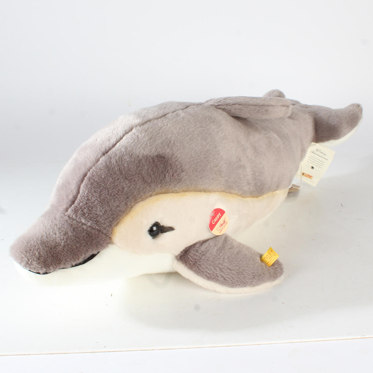STEIFF DOLPHIN 'CAPPY', WITH BUTTON AND LABEL.