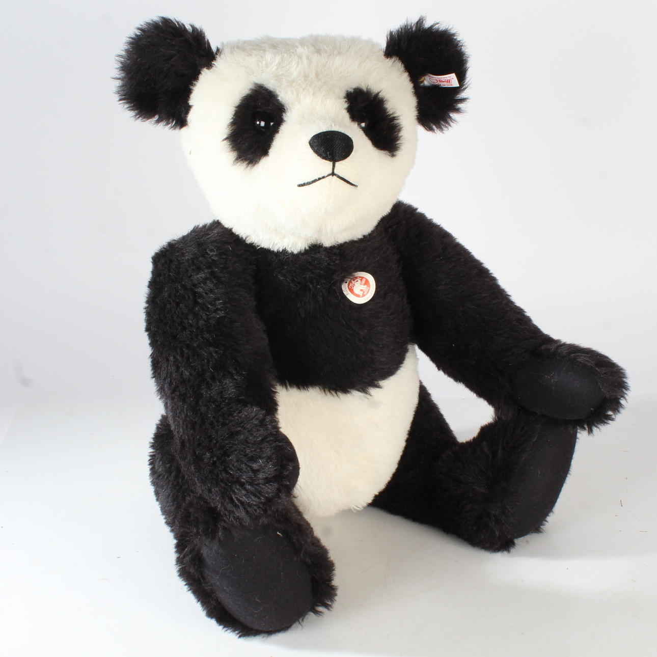LARGE STEIFF GROWLING PANDA WITH BUTTON AND LABEL.