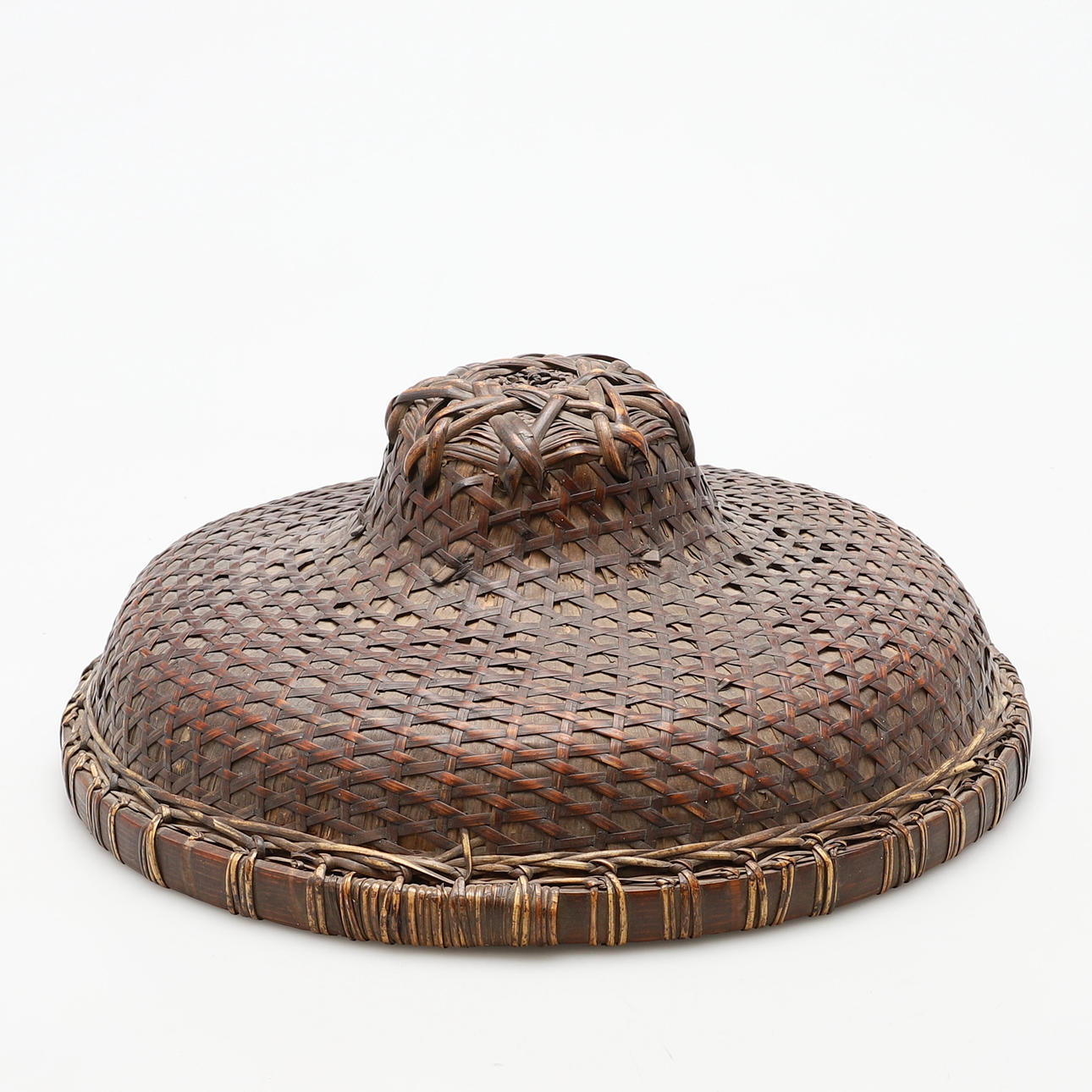 A CHINESE SPLIT CANE AND RATTAN SEDGE HAT.