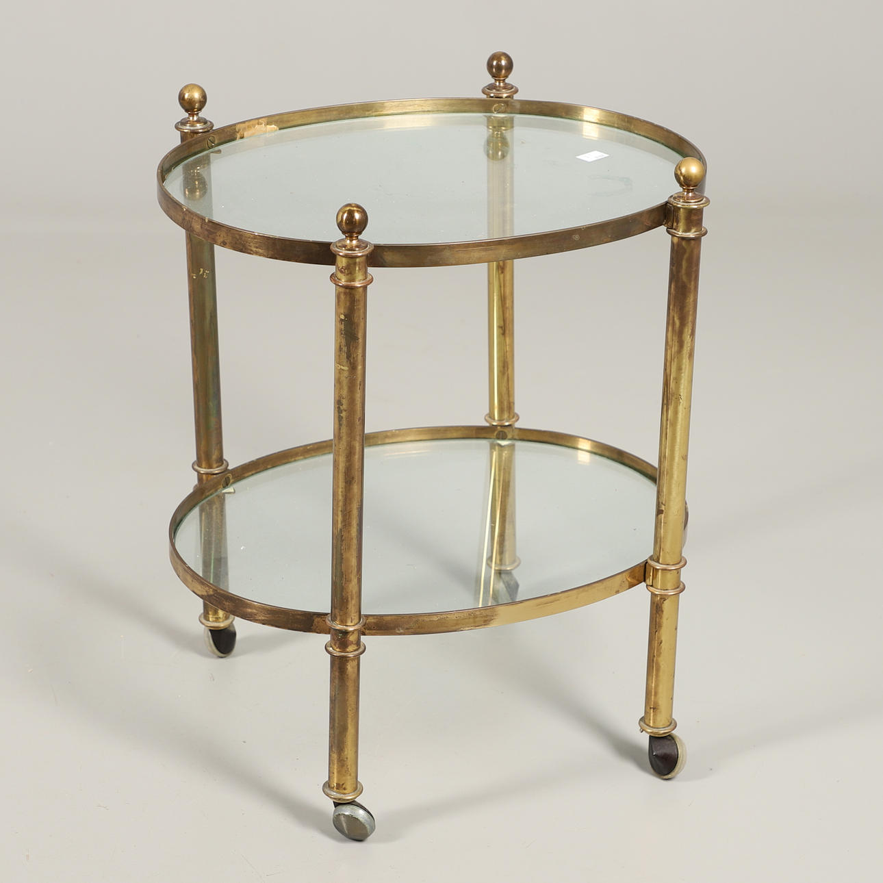 A SMALL BRASS TWO TIER TABLE.