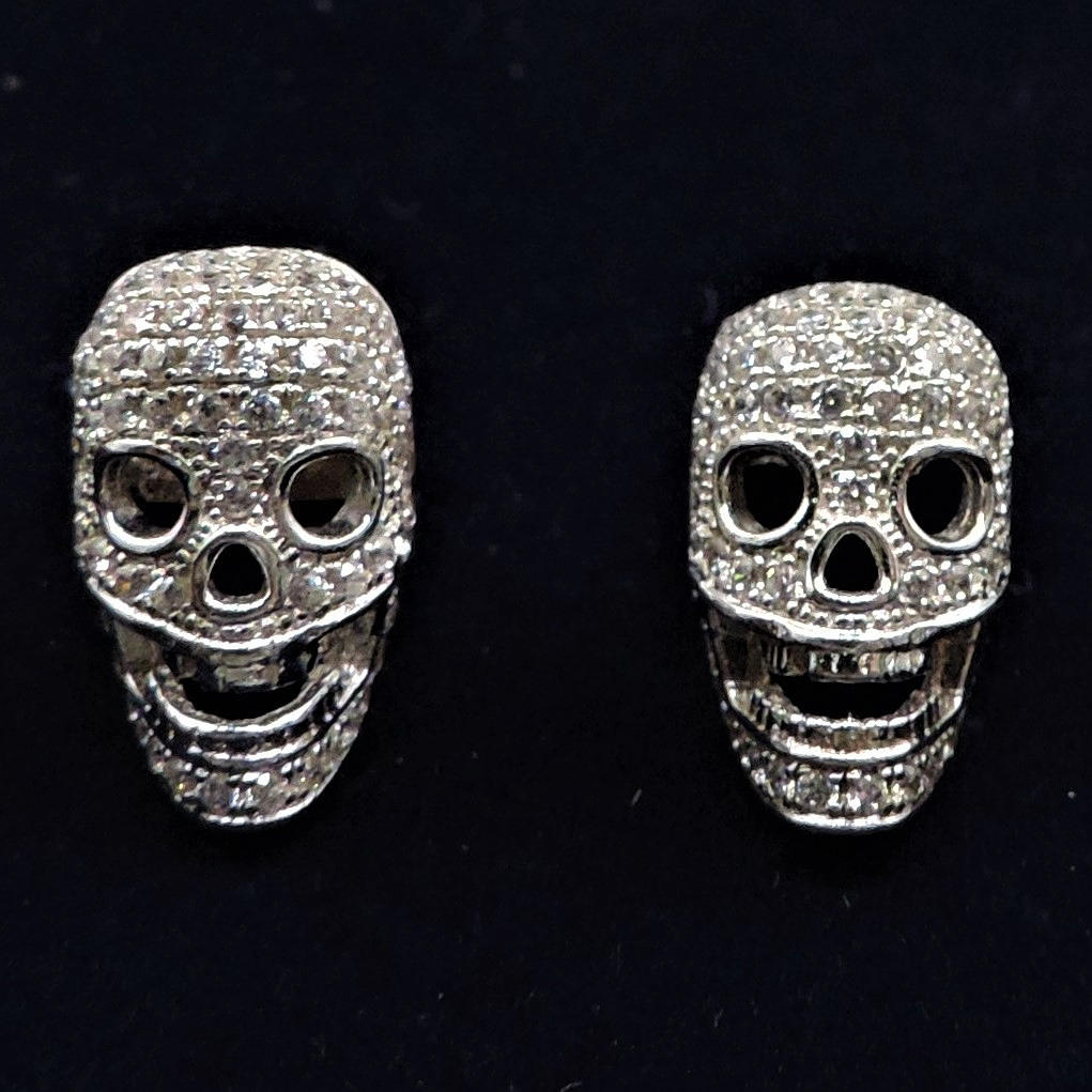 TRESOR PARIS SILVER CRYSTAL SKULL STUD EARRINGS.
