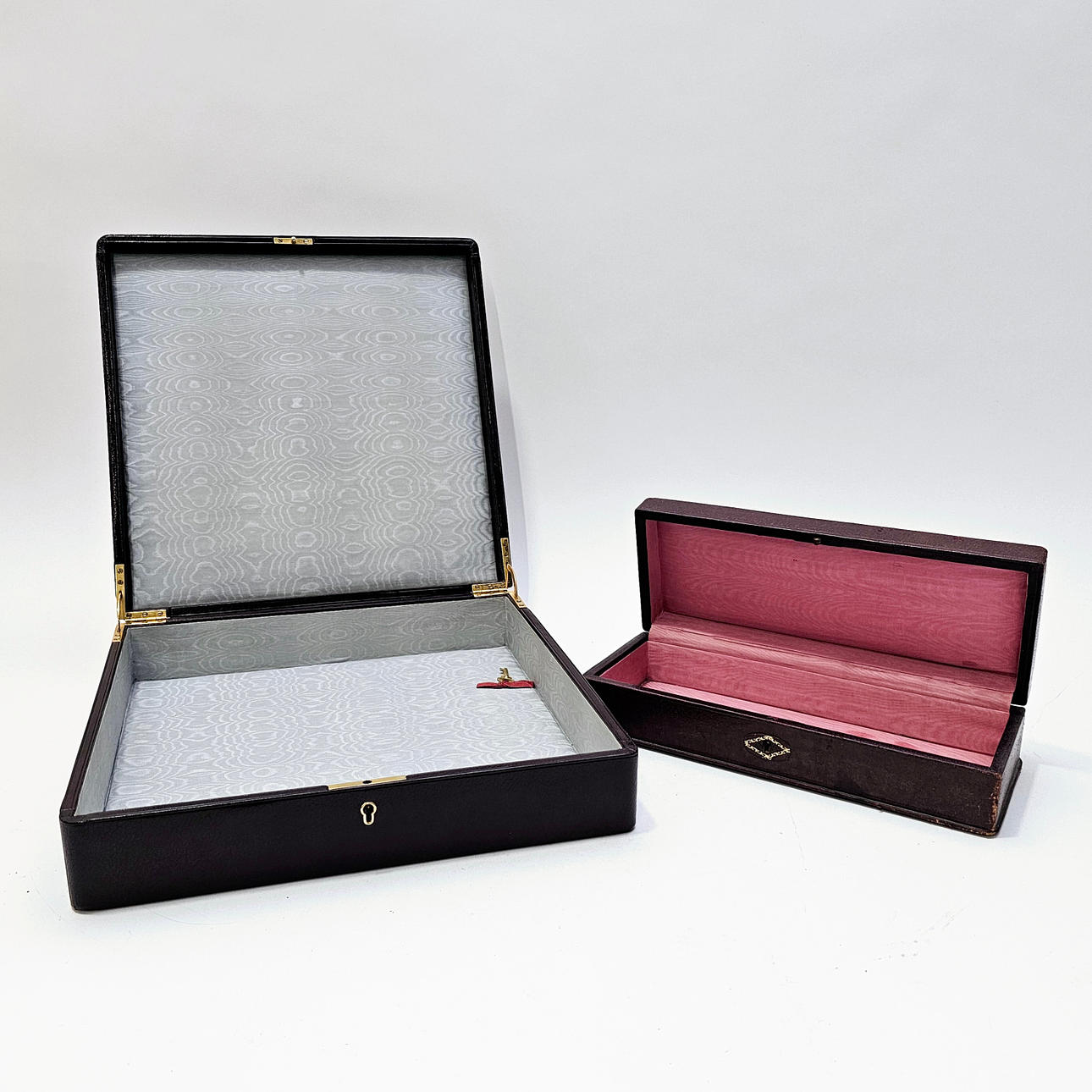 TWO BOXES IN RUSSIAN LEATHER WITH GOLDEN BORDER. 1950S.